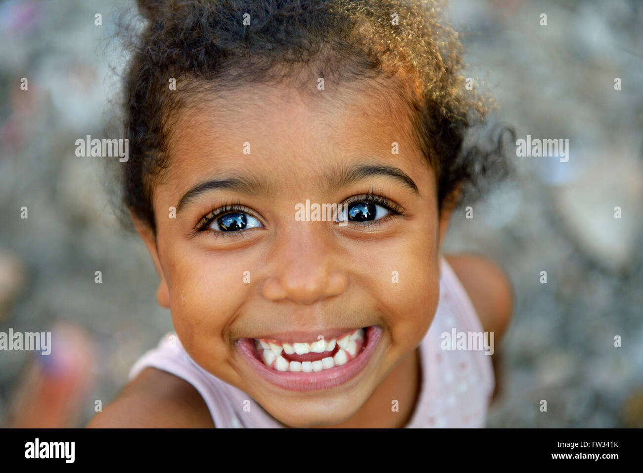 Laughing girl, 3 years, in a favela, Favela 21 de Abril, São Paulo, Brazil Stock Photo