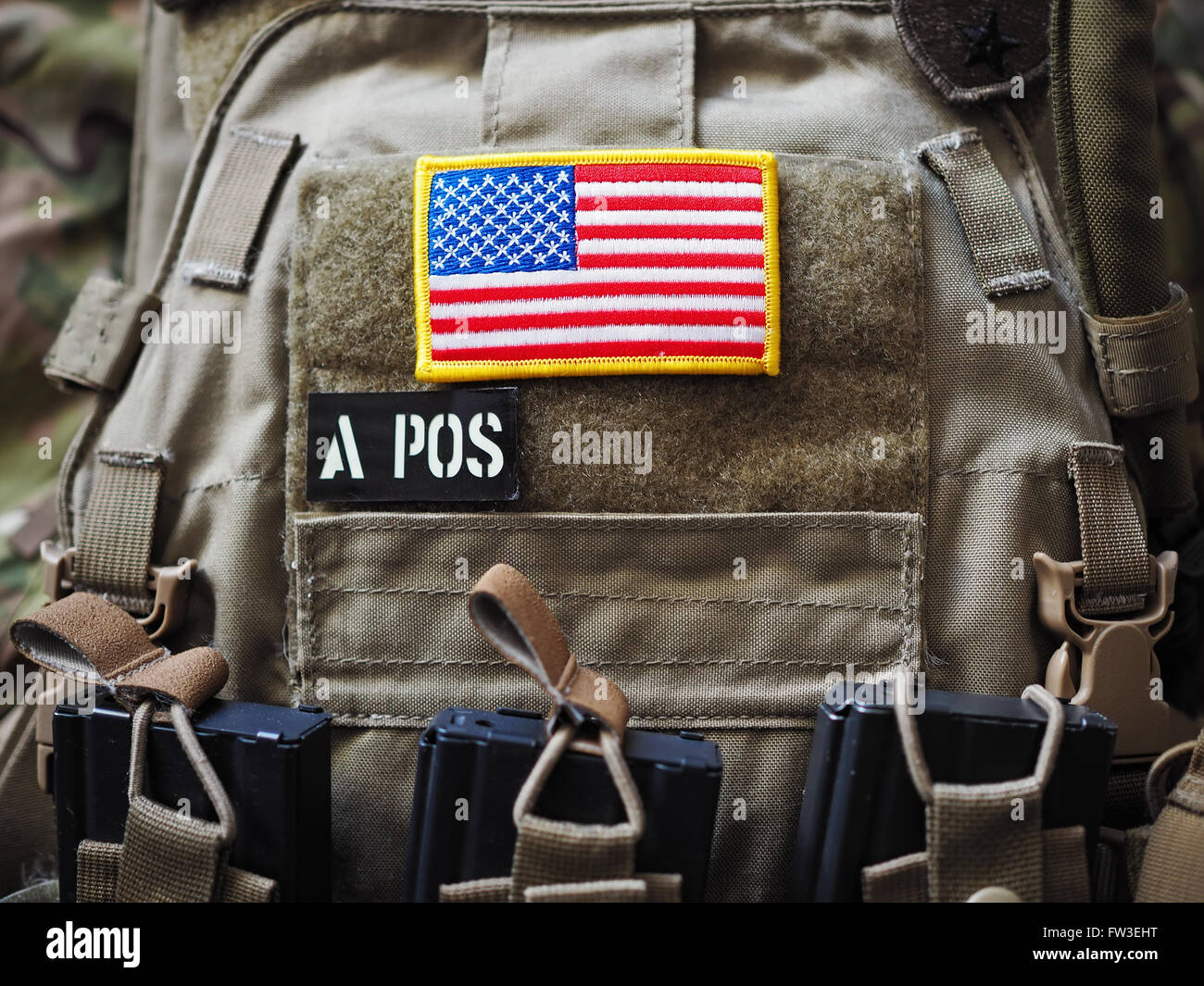 Plate Carrier with USA flag and blood type patches Stock Photo - Alamy