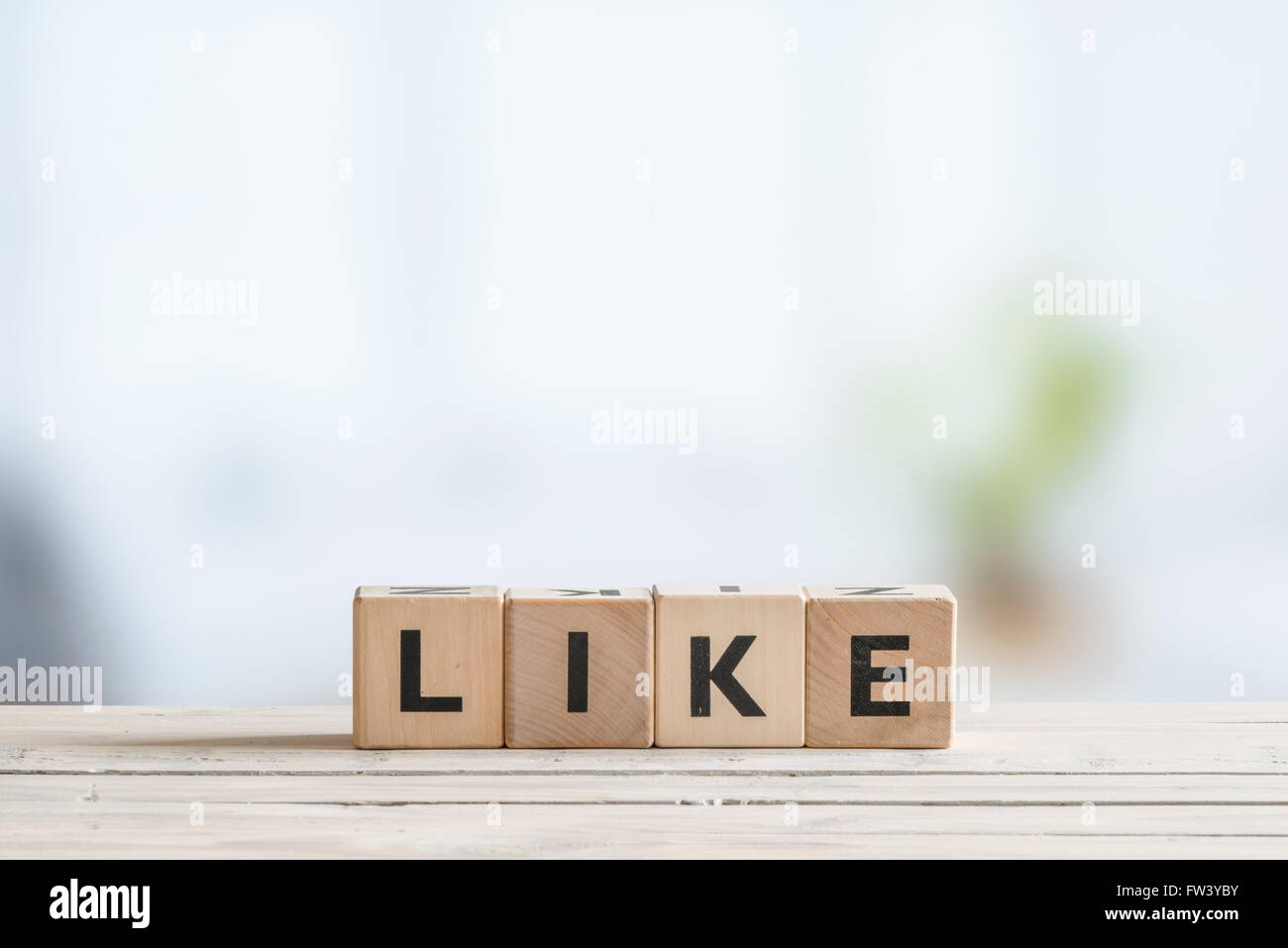 Like message made of cubes on a wooden desk Stock Photo