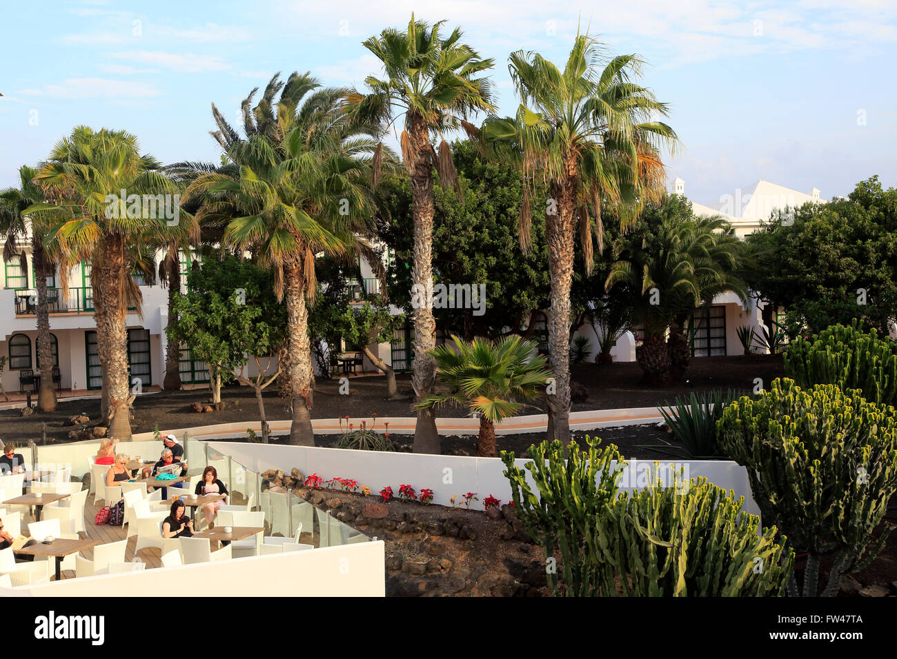Palm trees garden inside tourist hotel, H10 Ocean Suites, Corralejo, Fuerteventura, Canary Islands, Spain Stock Photo