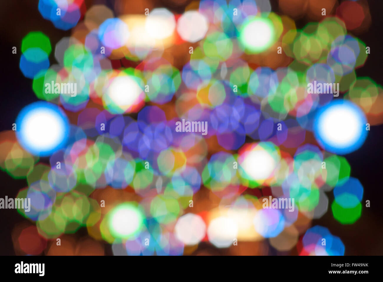 Light more color hexagon and cercle in bokeh out off focus in night. Stock Photo