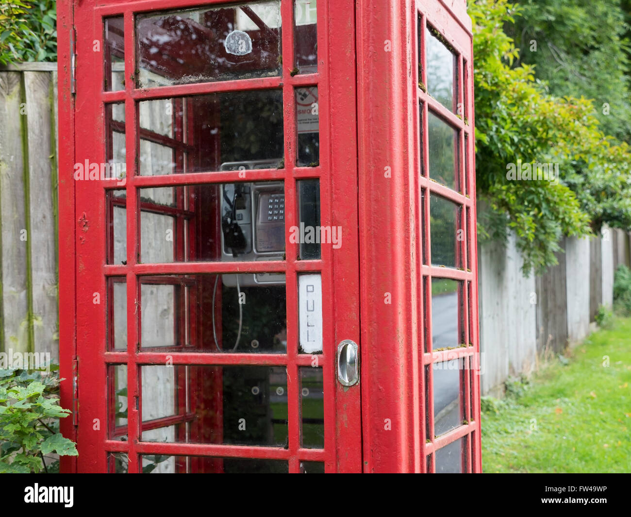 A traditional red phonebox in an English village. Stock Photo