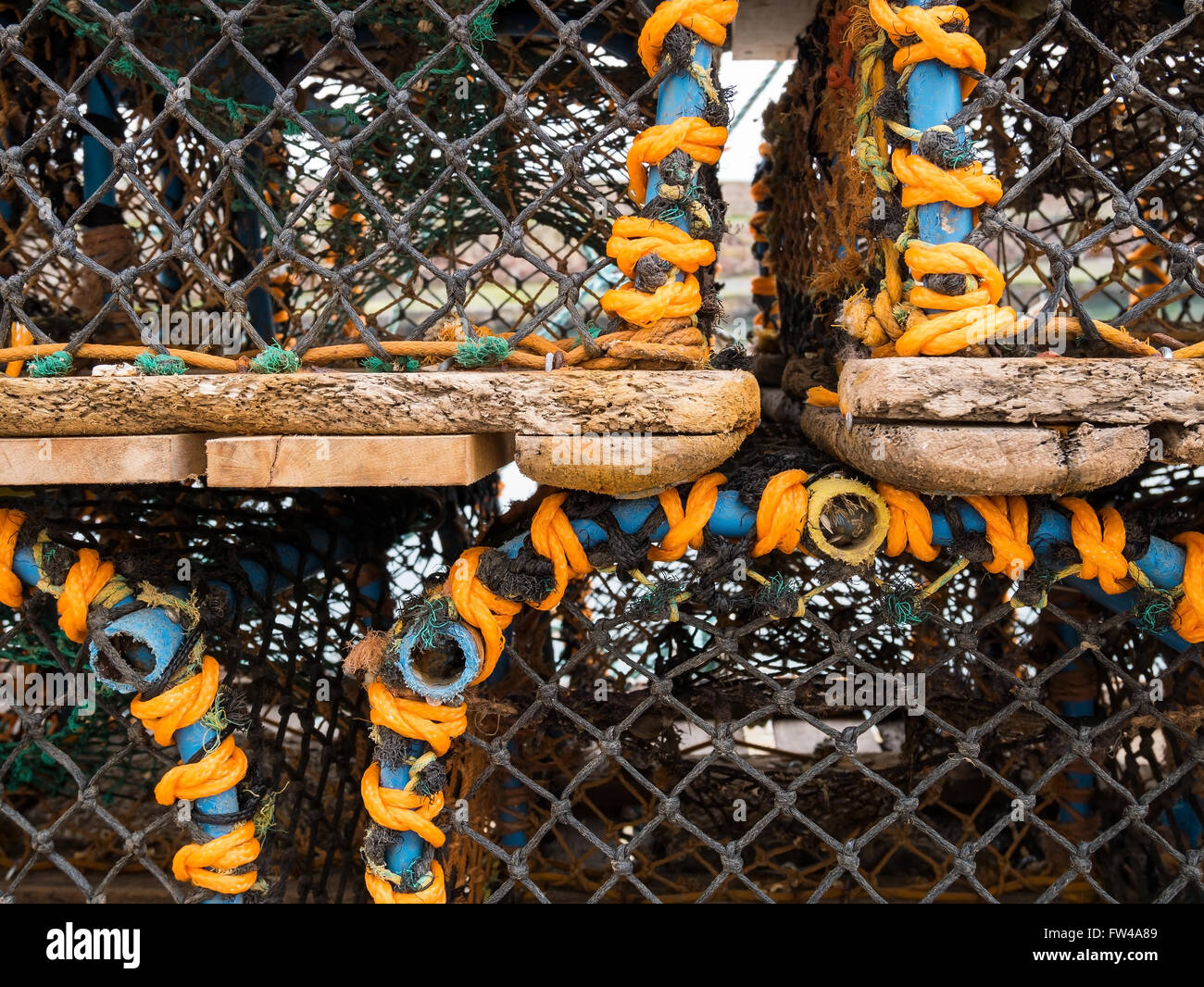 Details of stacked lobster and crab pots (creels) at a harbour in Scotland. Stock Photo
