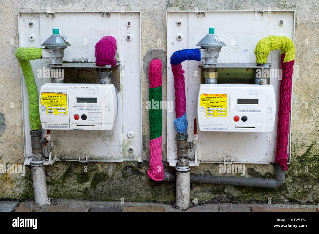 Yarn Bombing knitting graffiti in Bideford Devon, UK. Knitting has appeared covering gas meters in the town Stock Photo