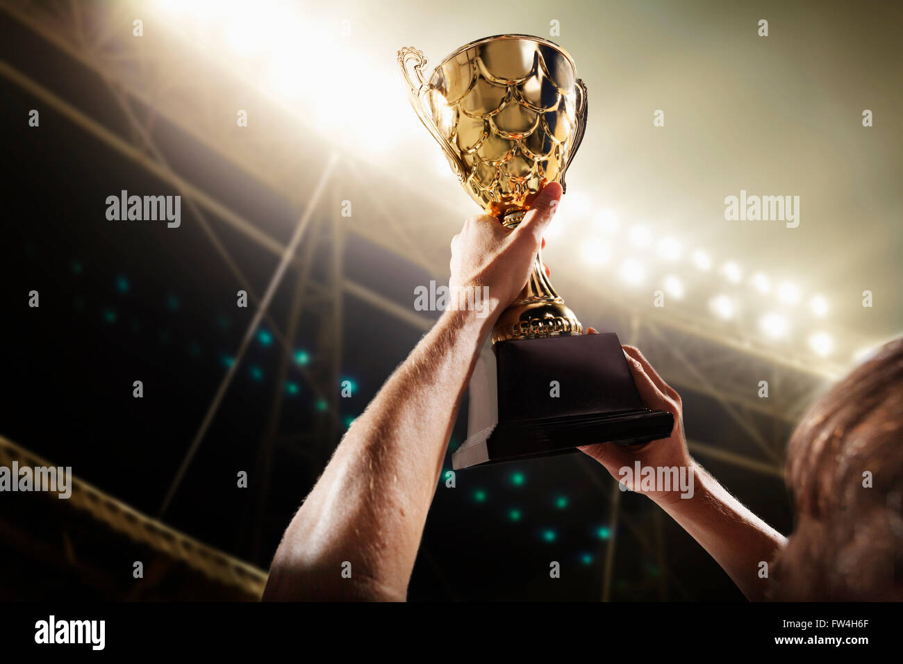 Athlete holding trophy cup Stock Photo Alamy