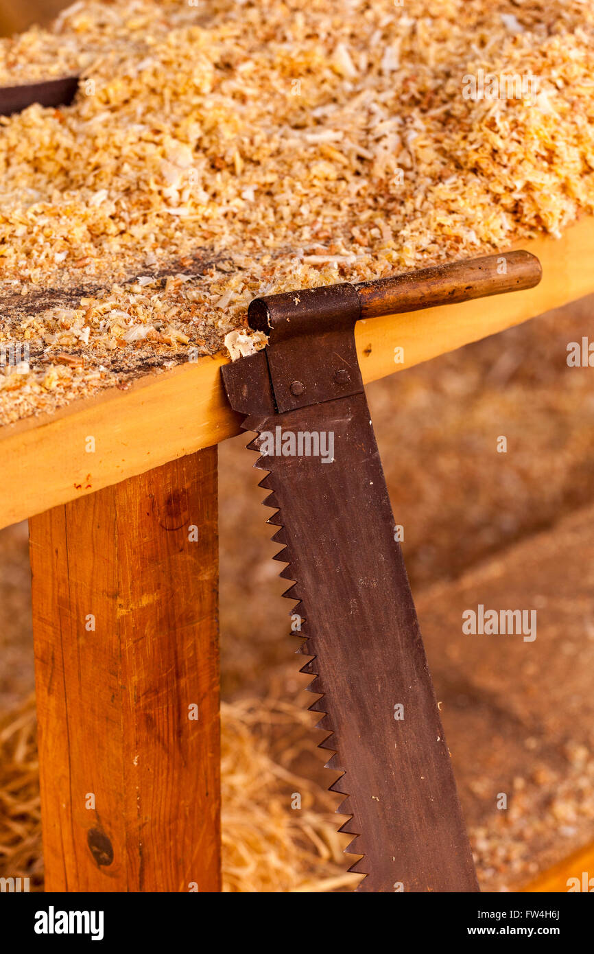 Old style saw with shavings and sawdust, stage setting for the Passion Play, Adeje, tenerife, Canary Islands, Spain. Representac Stock Photo