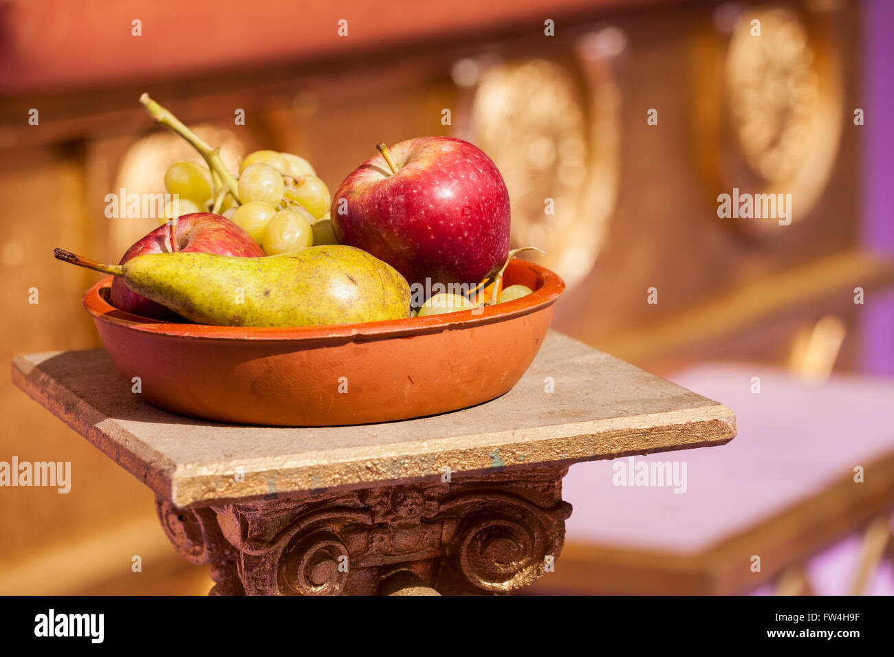 Terracotta bowl of fruit in the palace of Herod scene of the Passion Play, Adeje, Tenerife, Canary Islands, Spain. Representacio Stock Photo