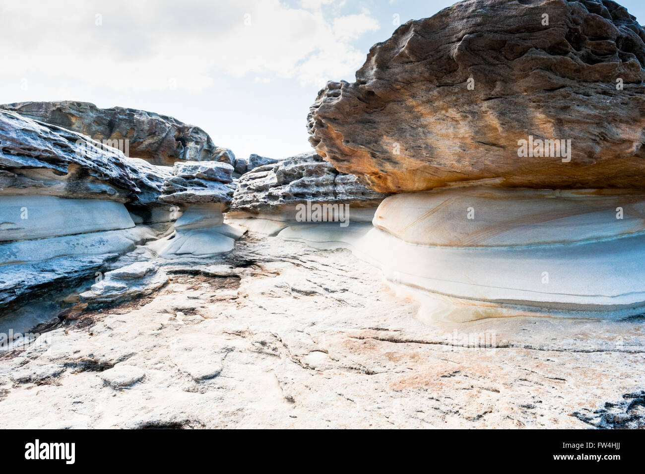 Rock formations eroded by wind and water along the Bondi to Coogee coastal cliff top walk in Sydney's Eastern suburbs Australia. Stock Photo