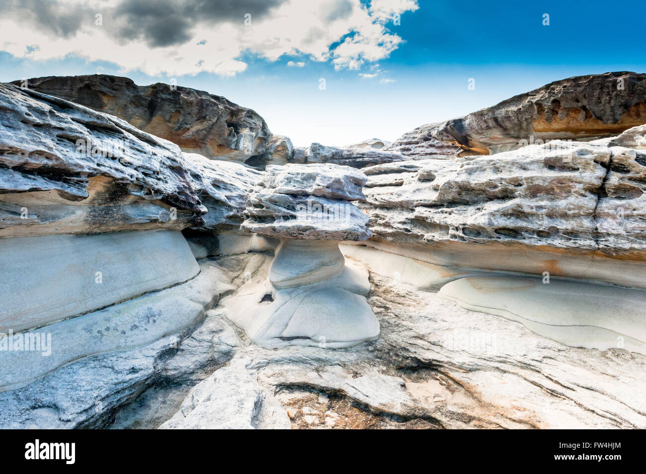 Rock formations eroded by wind and water along the Bondi to Coogee coastal cliff top walk in Sydney's Eastern suburbs Australia. Stock Photo