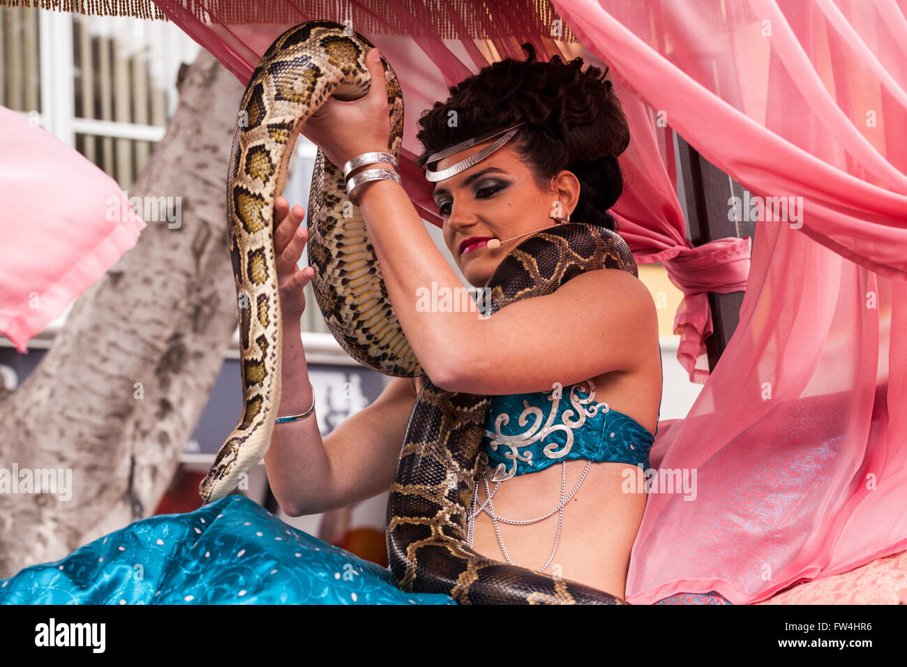 Actress playing Salome with a live boa constrictor snake in the Passion play, Adeje, Tenerife, Canary Islands, Spain. Representa Stock Photo