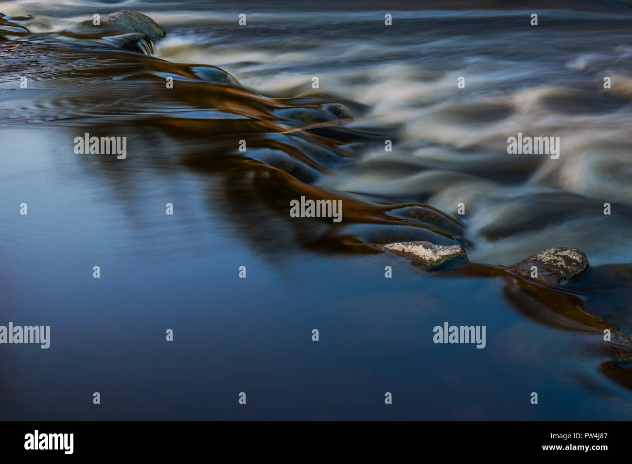 Water flow through the stones Stock Photo