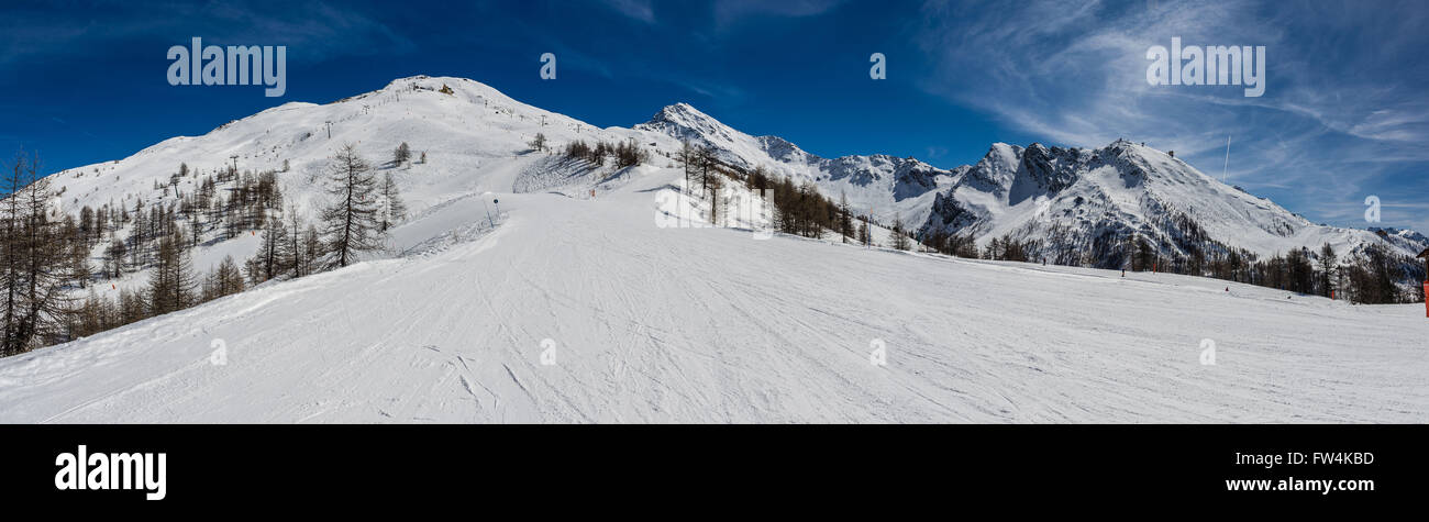View over the snow-clad slopes of Sestriere in the Milky Way ski resort in Piedmont. Stock Photo