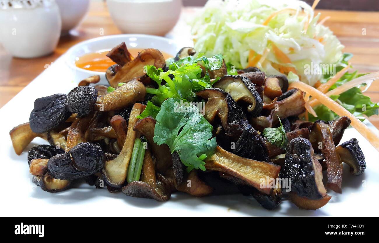Shiitake Mushroom Sauteed with soy bean sauce Stock Photo