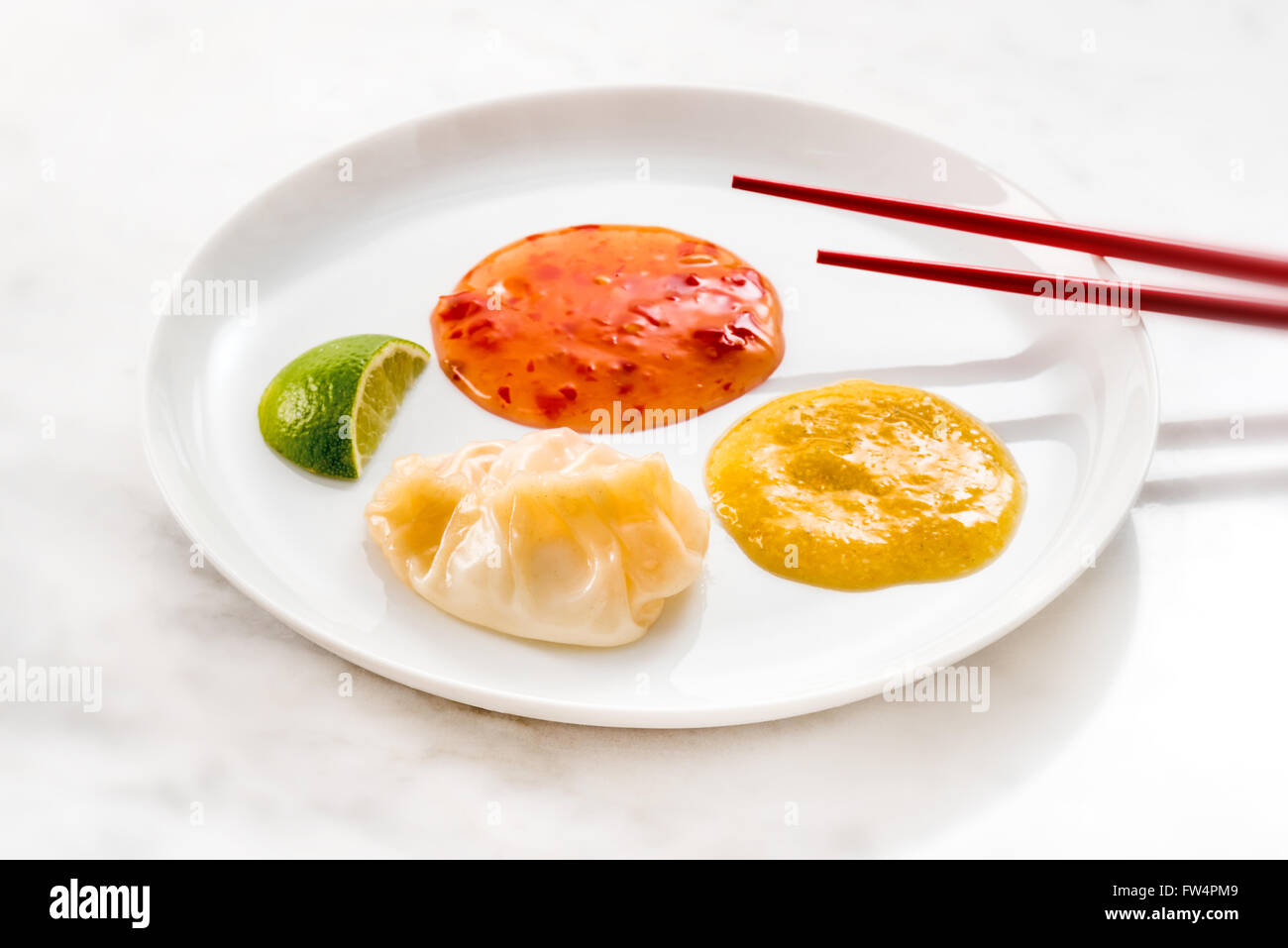 Jiaozi dumplings food stuffed chinese exotic chopsticks asia asian. Spicy fine different, single, food for singles, quickly prep Stock Photo