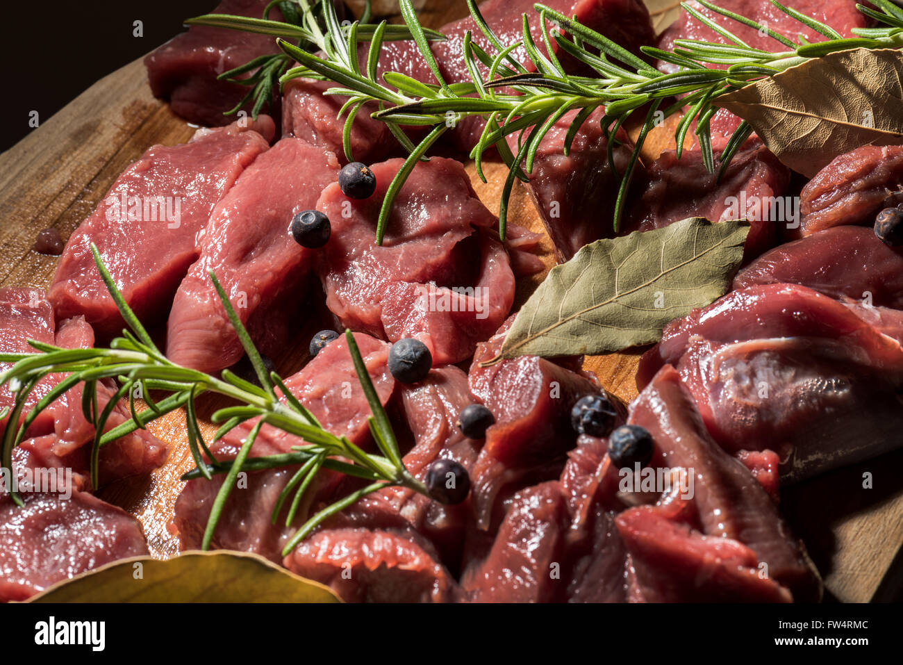 Deer meat, Schlegel, DEER, meat, Sliced, venison, rosemary, juniper, laurel, goulash, Wildgoulasch, fry cooking, kitchen, long, Stock Photo