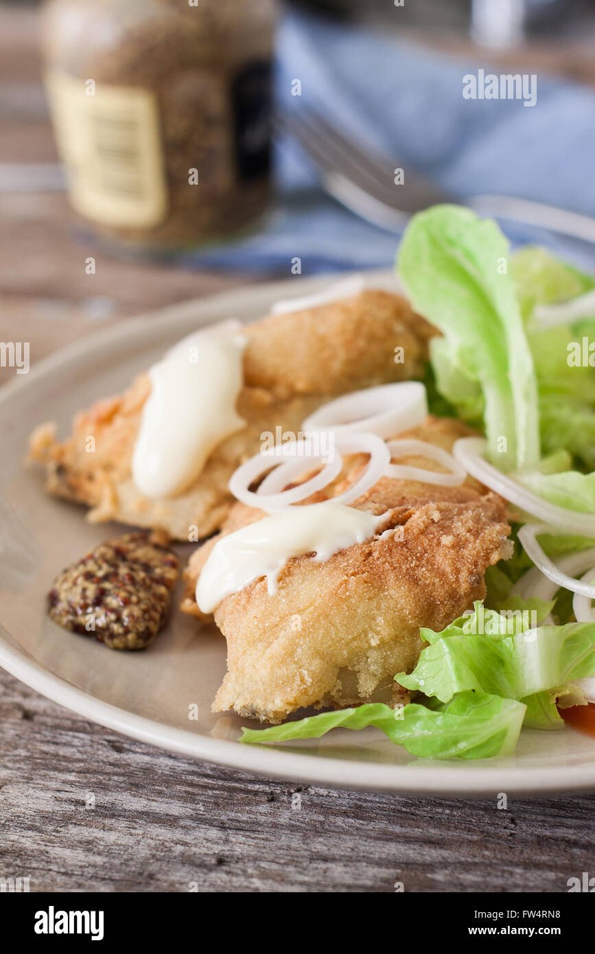 deep fried cod fish with salad mayonnaise and mustard Stock Photo Alamy