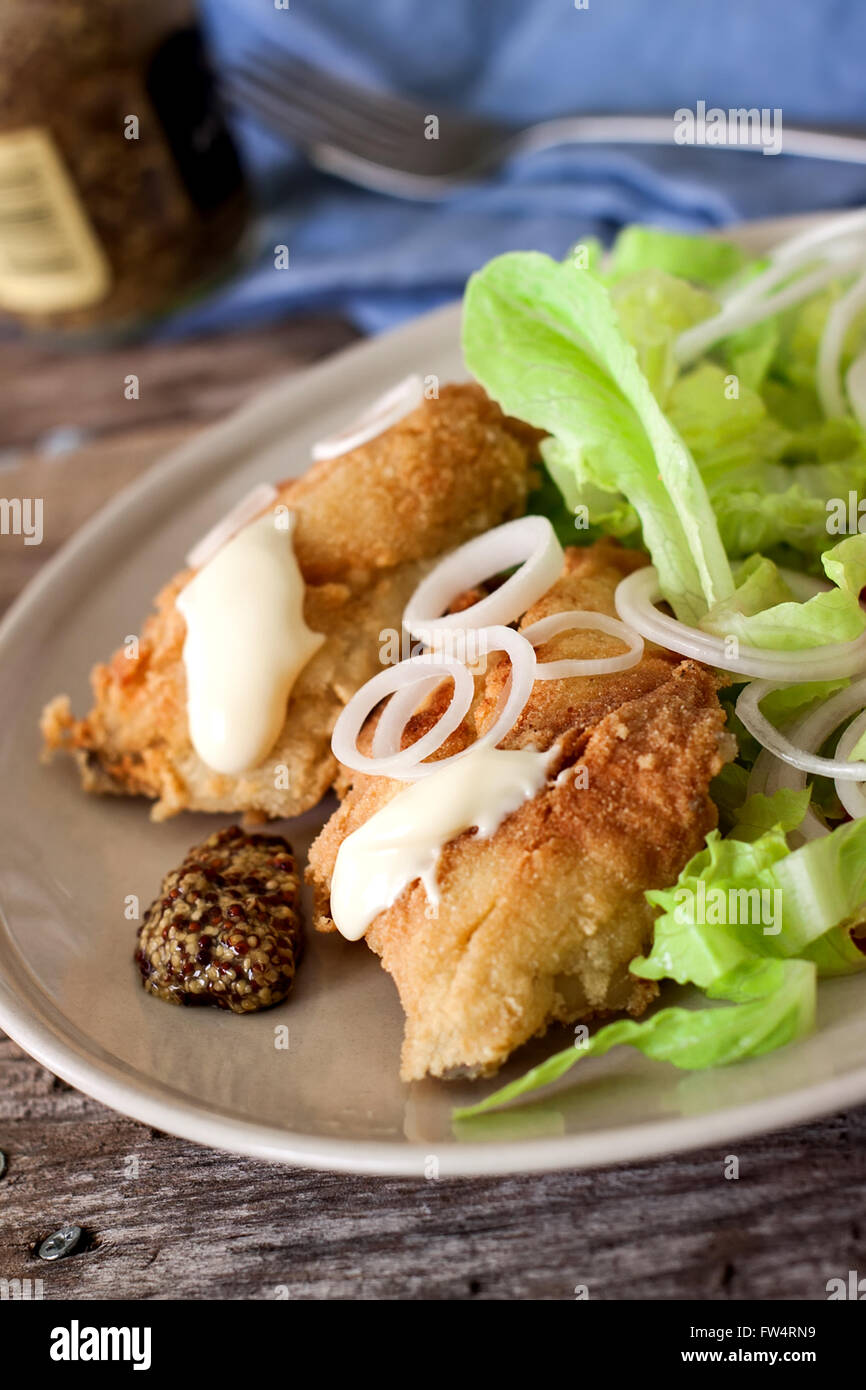 deep fried cod fish with salad mayonnaise and mustard Stock Photo Alamy