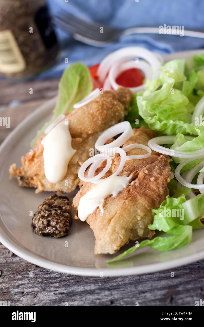 deep fried cod fish with salad mayonnaise and mustard Stock Photo Alamy
