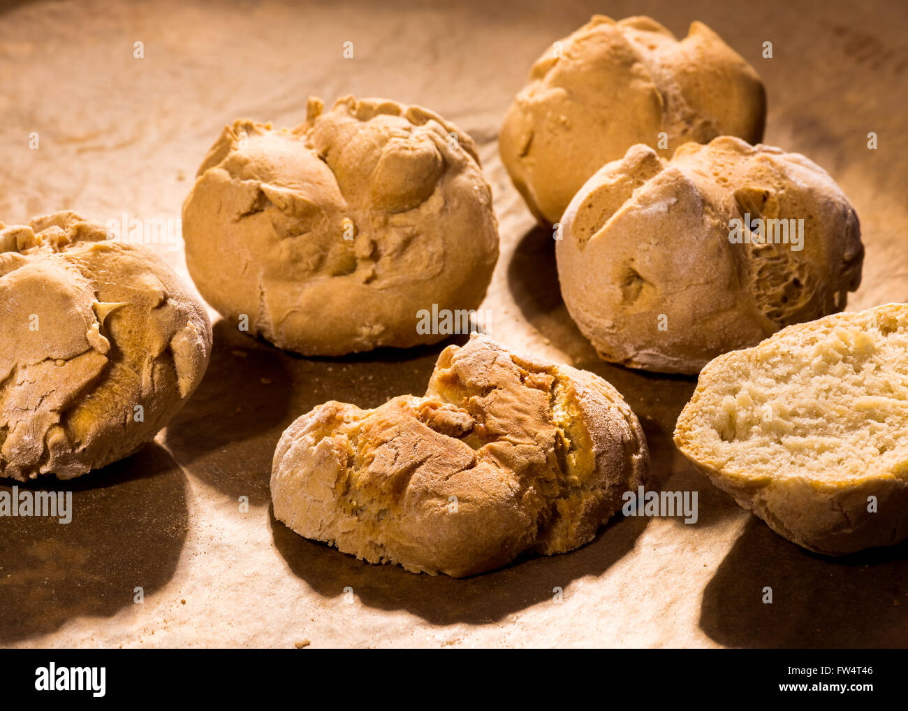 Homemade hand-made bread roll white bread on back plate cook bake self single for your own household home bakery fresh fragrant Stock Photo