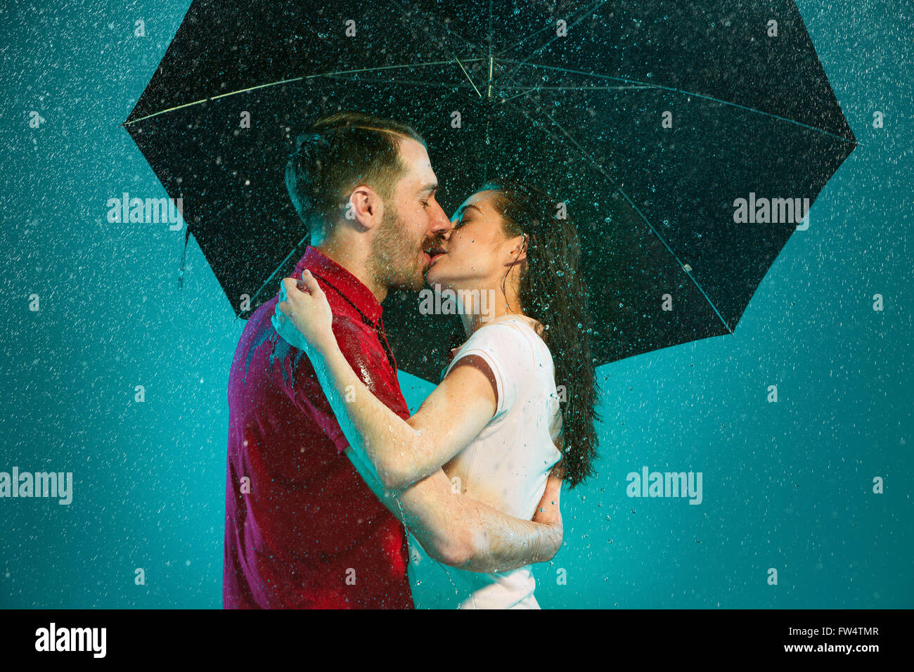 The loving couple in the rain Stock Photo - Alamy