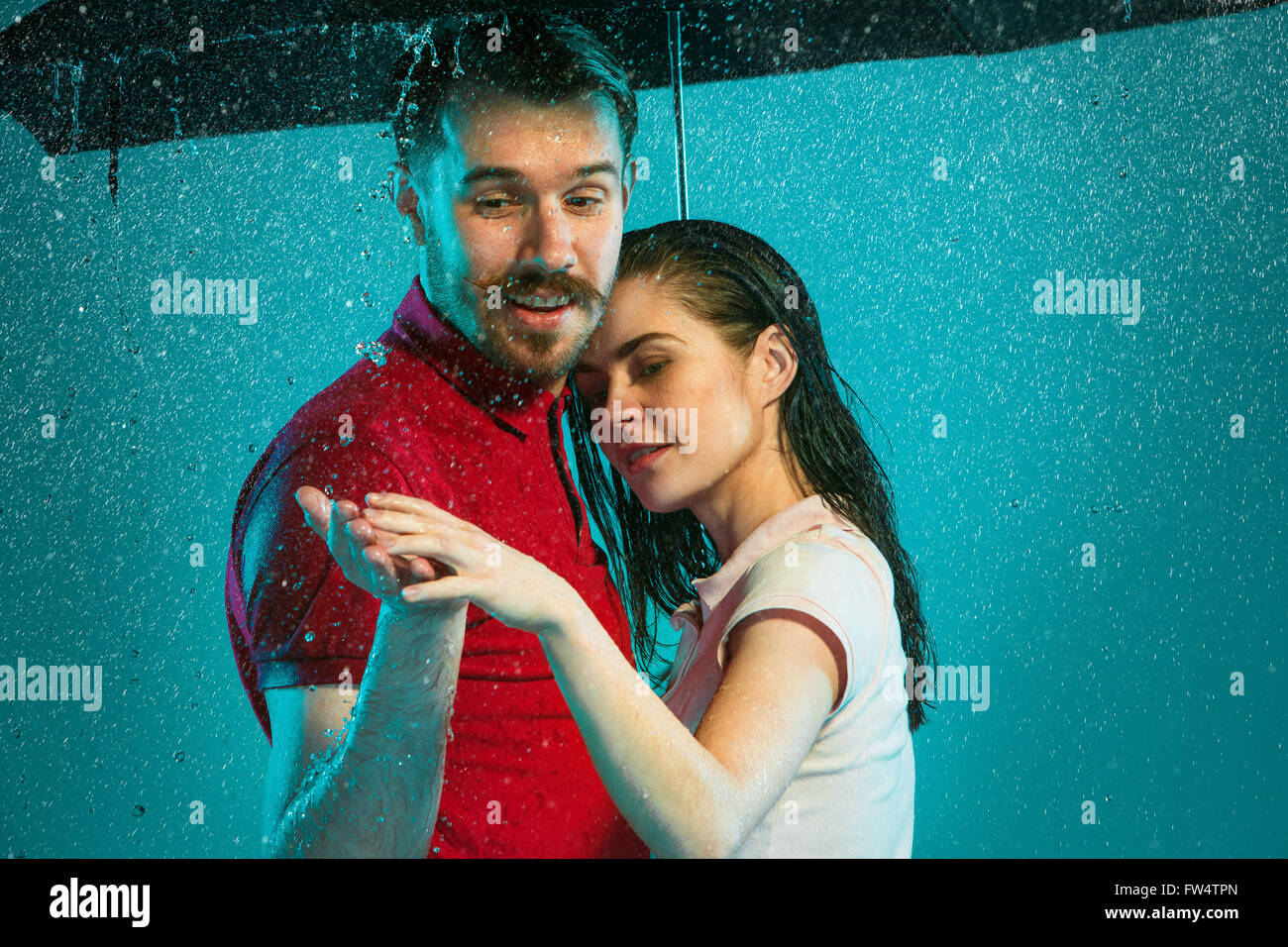 The loving couple in the rain Stock Photo - Alamy