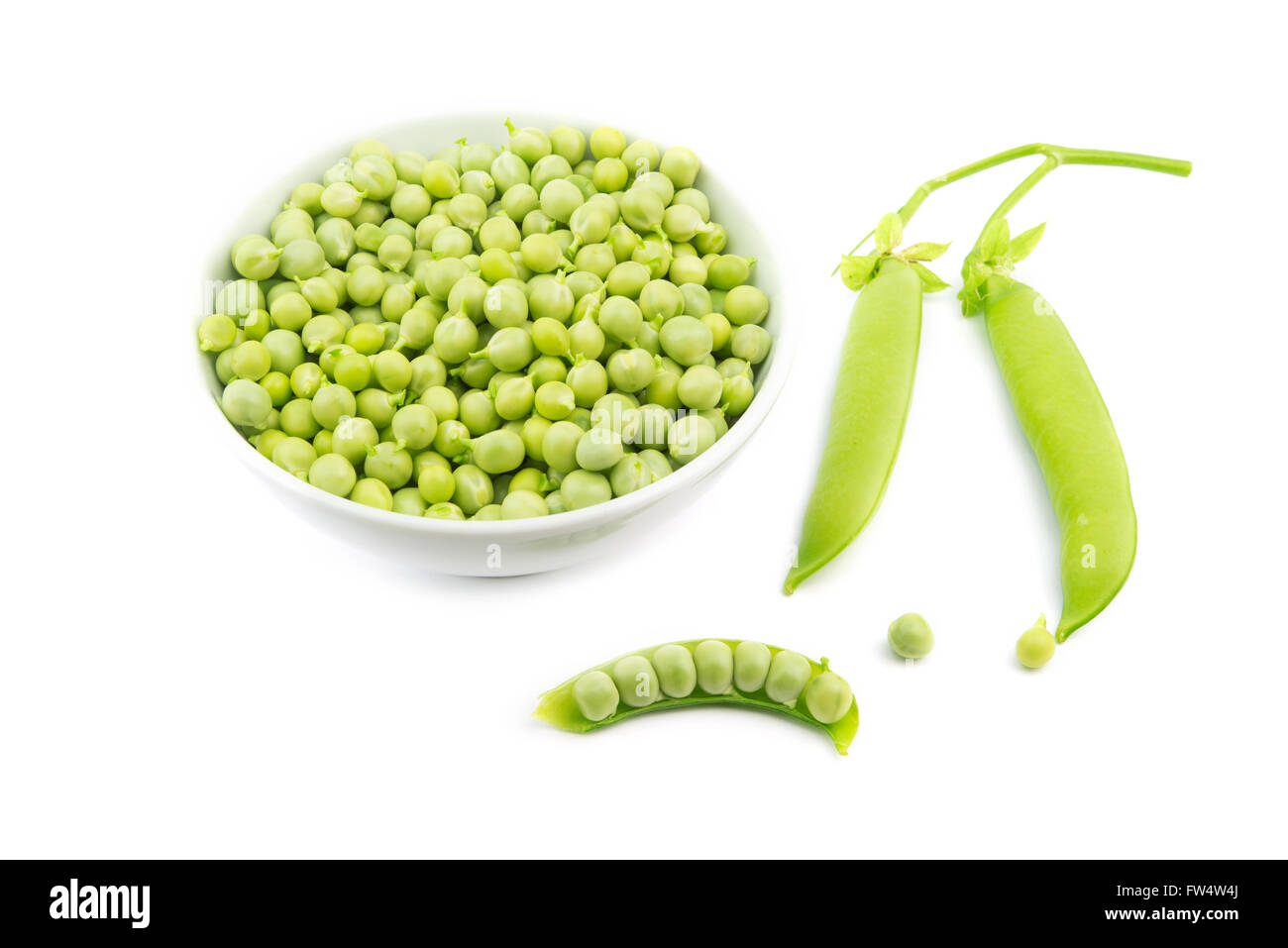 raw green peas bowl on white background Stock Photo