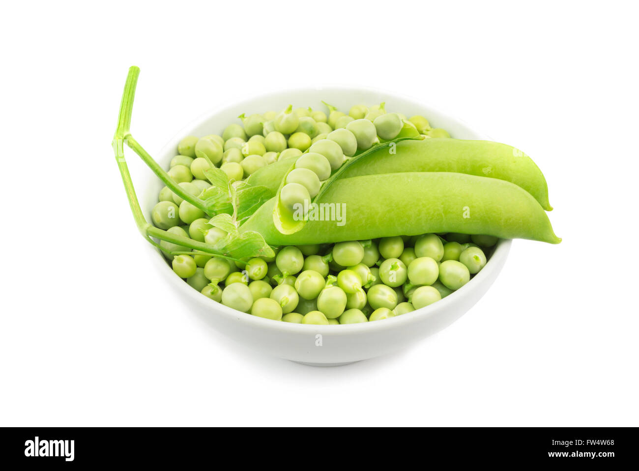 raw green peas bowl on white background Stock Photo
