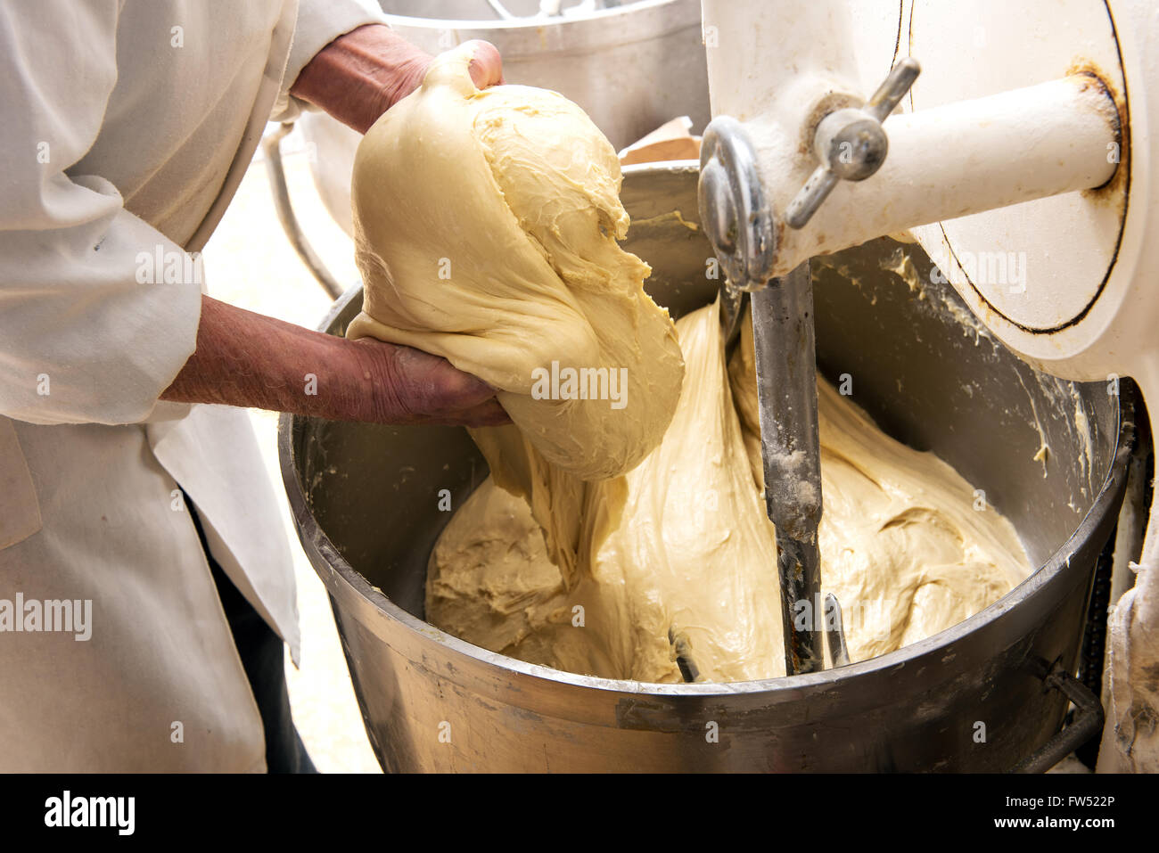 Bread Mixer In Bakery, mixing dough for baguettes in a bakery machine for  mixing dough Stock Photo - Alamy