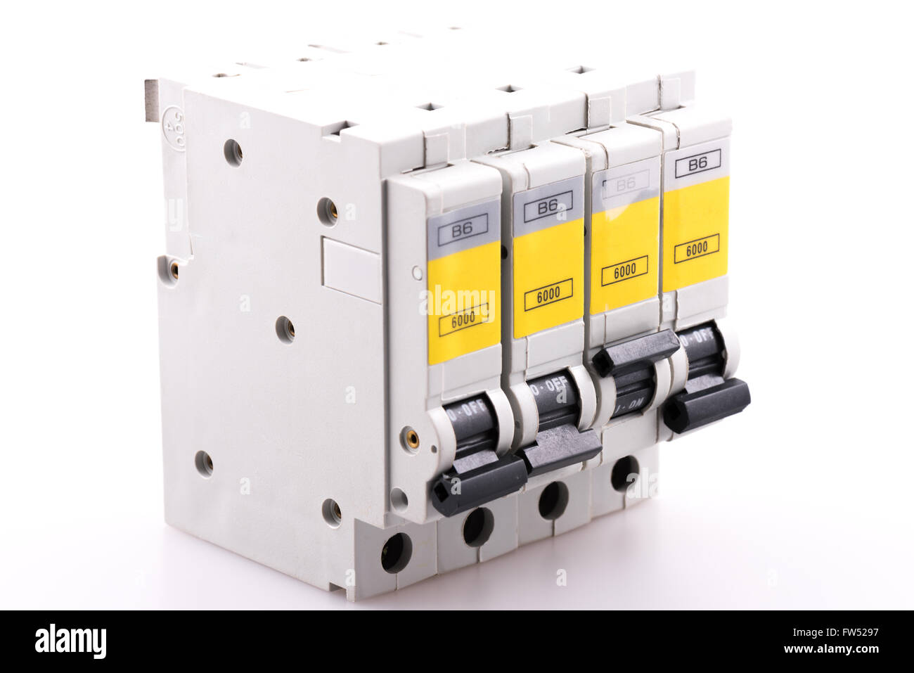 Four 6 Amp Miniature circuit breakers on a white background Stock Photo
