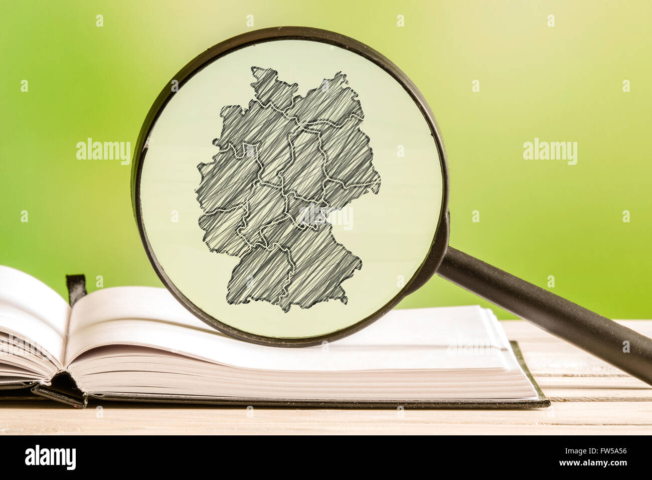 Germany with a pencil drawing of a german map in a magnifying glass Stock  Photo - Alamy