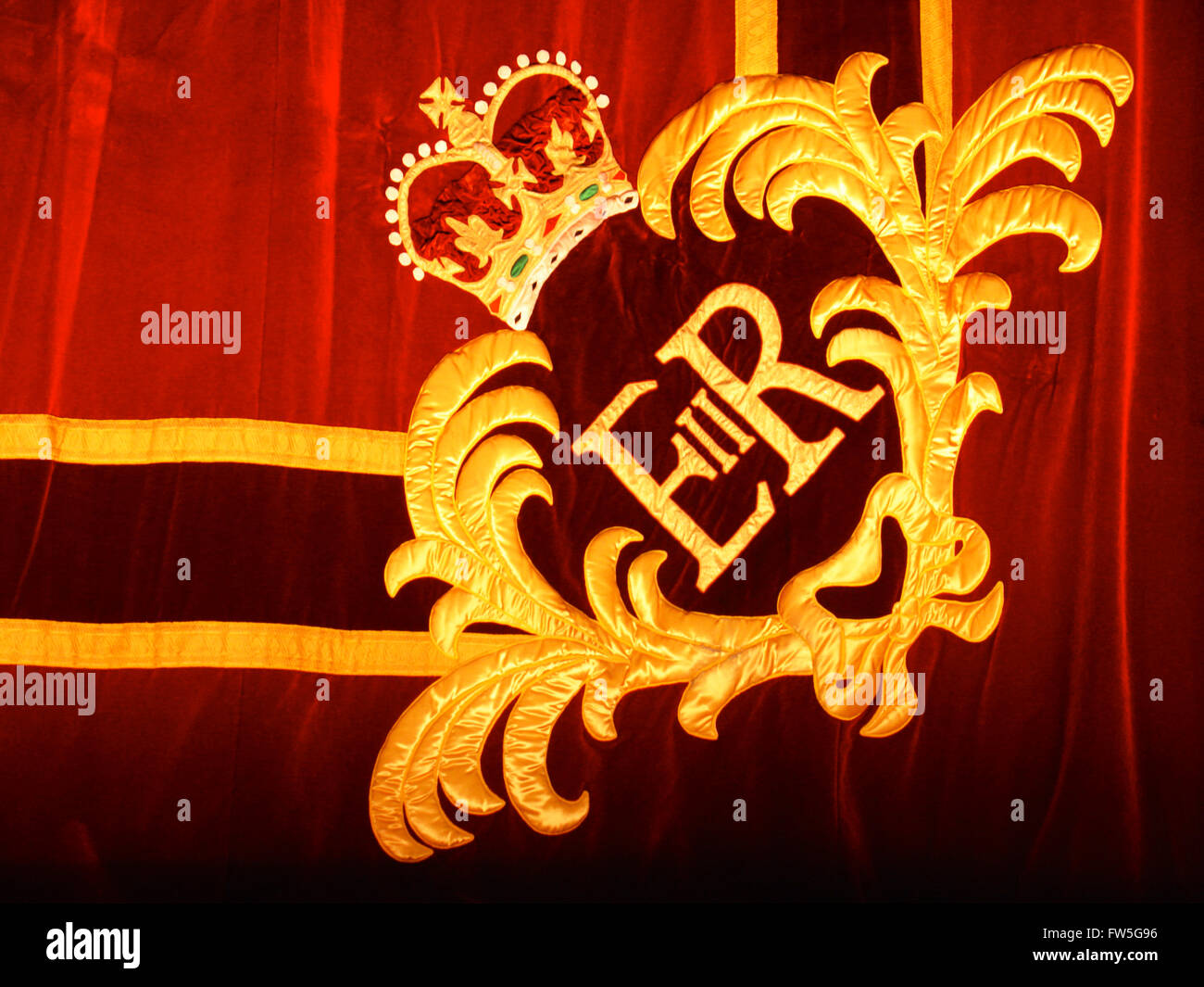 Red plush curtain with ER II crest at the Royal Opera House, Covent Garden, London. Stock Photo