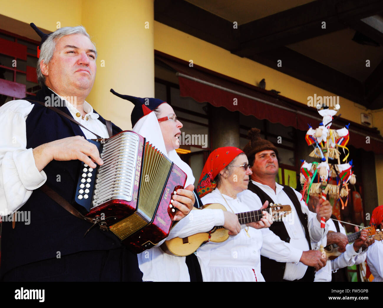 Festive folk musicians in costume, with local speciality instruments. Madeira: Funchal Stock Photo
