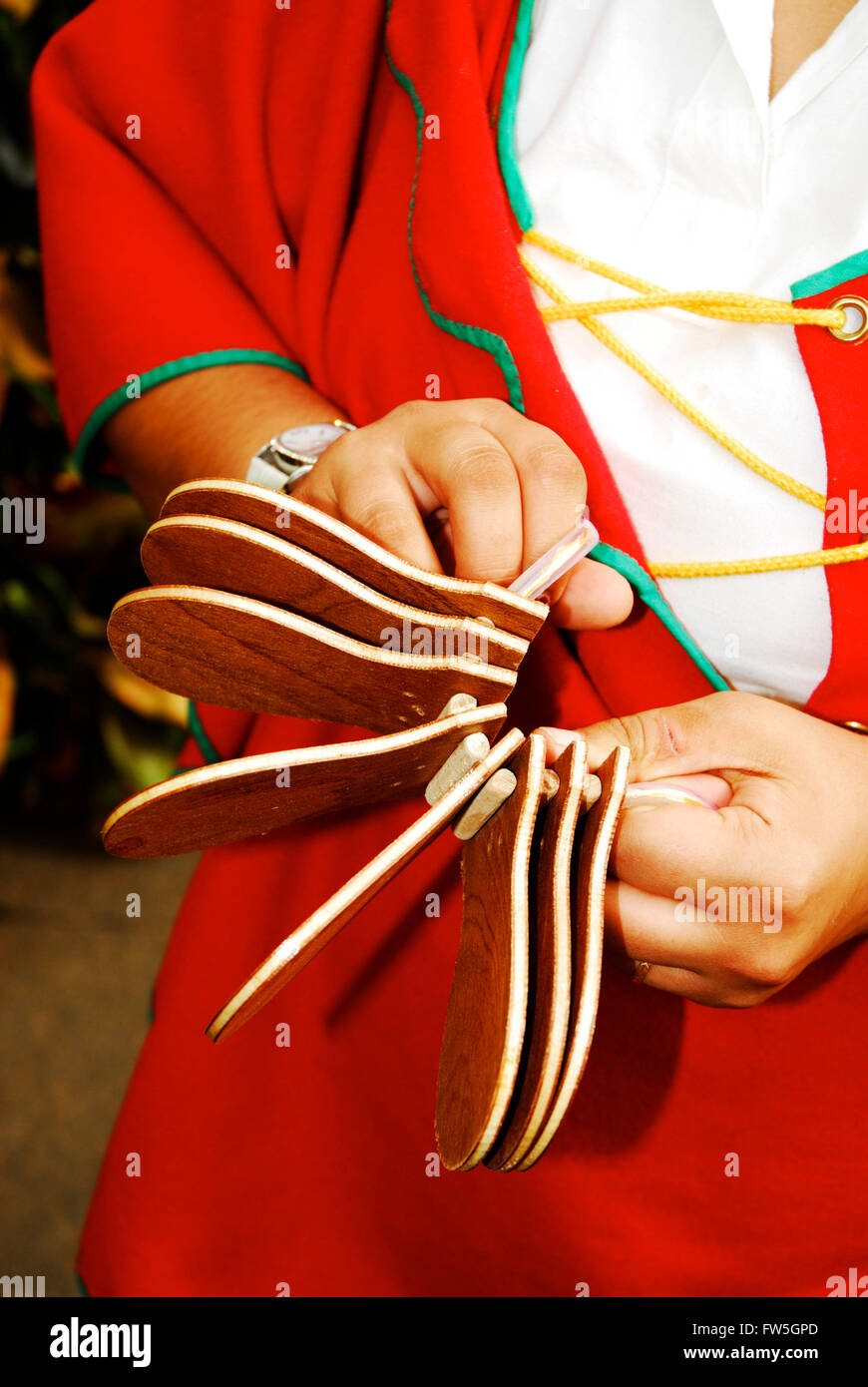 Festive folk musician in costume, with Portuguese of local