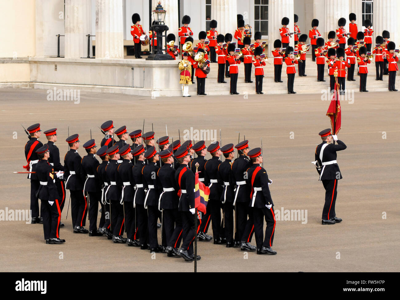 Grenadier Guards Band, The Royal Military Academy, Sandhurst, Sovereign’s Parade, officer graduation parade (officers are trained here), marching with colours Stock Photo