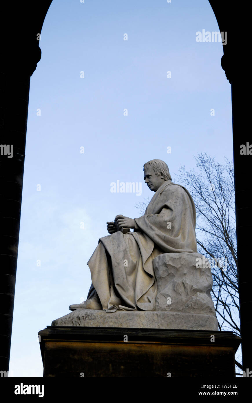Statue of Sir Walter Scott, author, Romantic Scottish poet, 1714-1832 seated, in profile, Edinburgh. Stock Photo