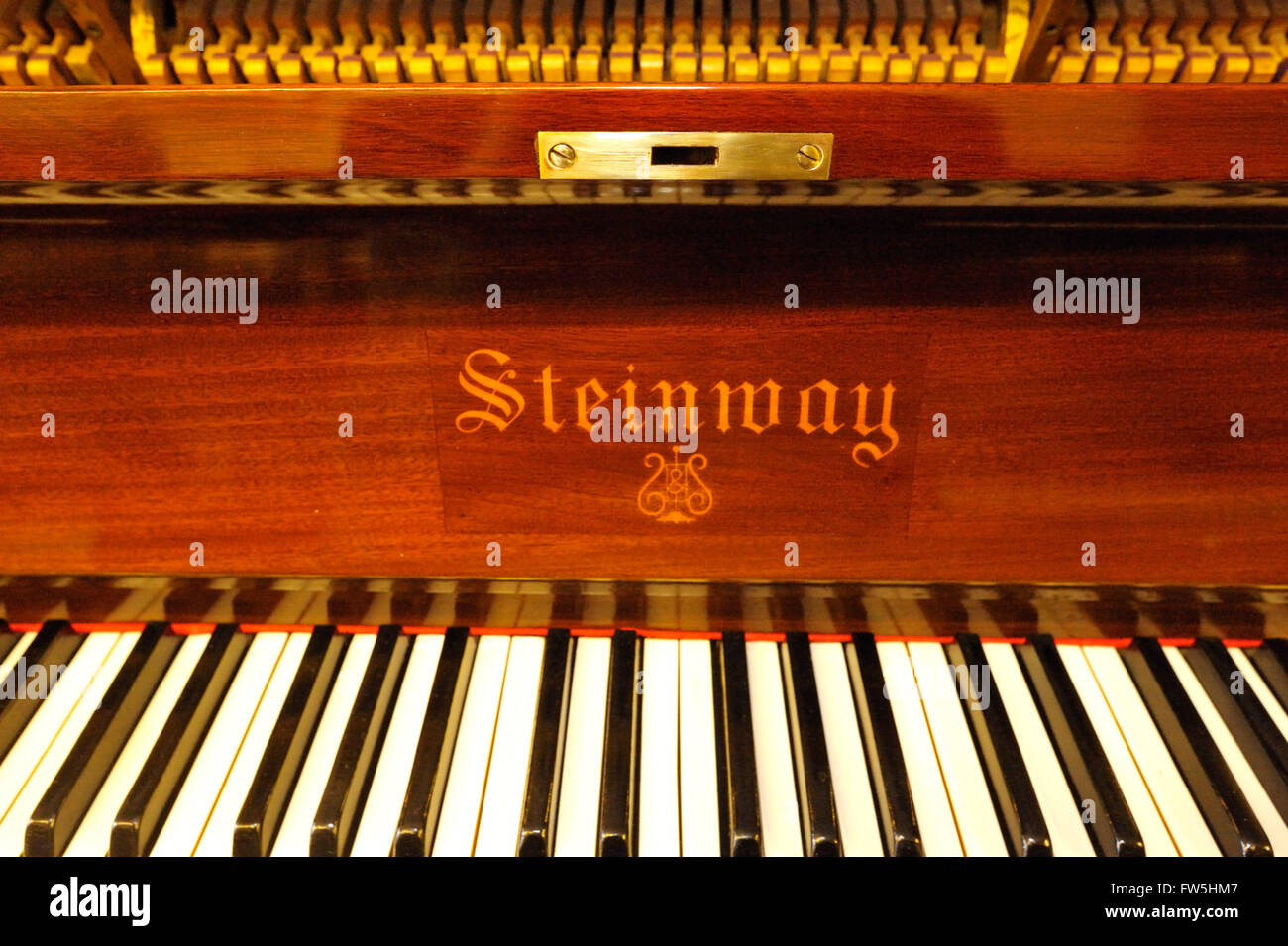 Piano mechanism - keyboard and logo on lid of Steinway upright piano, 1909, Stock Photo