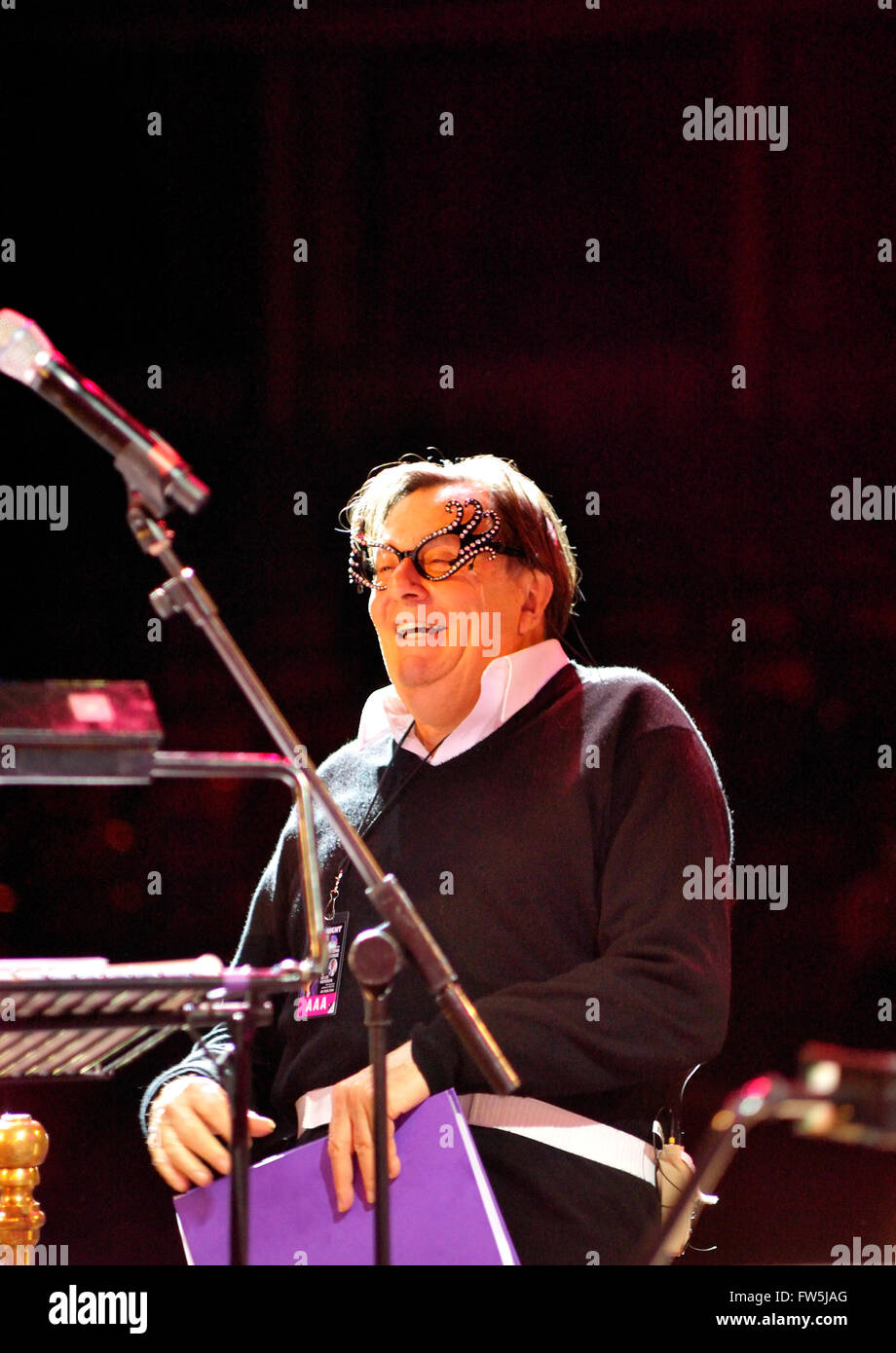 Barry Humphries, wearing his 'Dame Edna Everage' spectacles, Australian actor / comedian in rehearsal at the Royal Albert Hall with the RPCO, for the 'Last Night of the Poms' tour ('more of a tourette'), playing his alter egos Dame Edna Everage and Sir Les Paterson, representative of Australian culture. Score written and conducted by American conductor and composer Carl Davis, who first performed the show 28 years ago immediately after the English Proms season in 1981. Stock Photo
