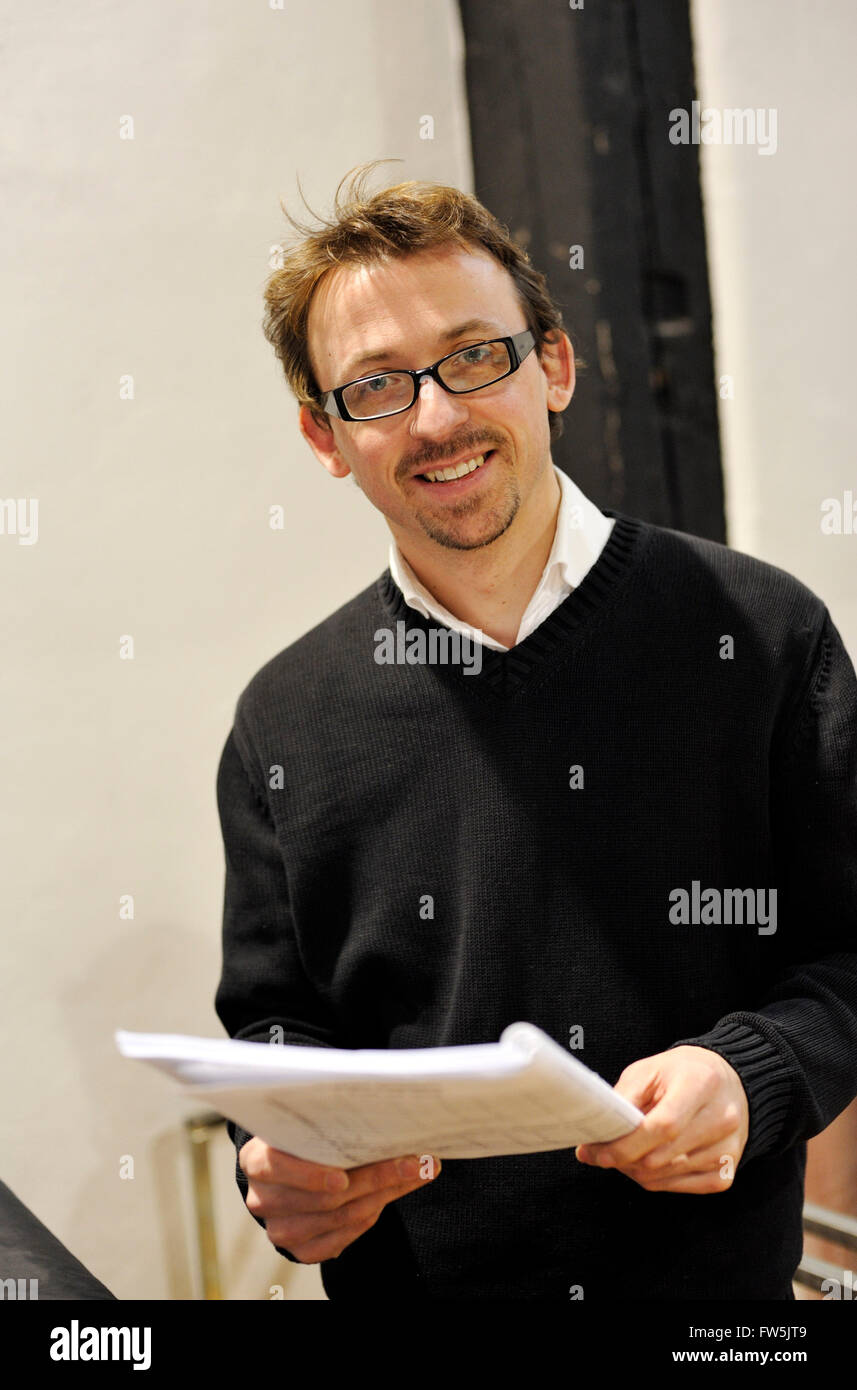 British composer Will Todd (b. 1970) holding a score of his new Clarinet Concerto for Emma Johnson, performed with the MKCO, Milton Keynes City Orchestra. His diverse catalogue of works includes the opera The Blackened Man; oratorios The Burning Road and St Cuthbert; concertos for violin, trumpet and saxophone; and particularly his works for choir, ranging from the large scale Mass in Blue to smaller works suitable for inclusion in liturgical settings. He has worked with the BBC Singers, The Sixteen, the Halle Orchestra, the Northern Sinfonia Chorus, WNO and the Royal Opera House. Stock Photo