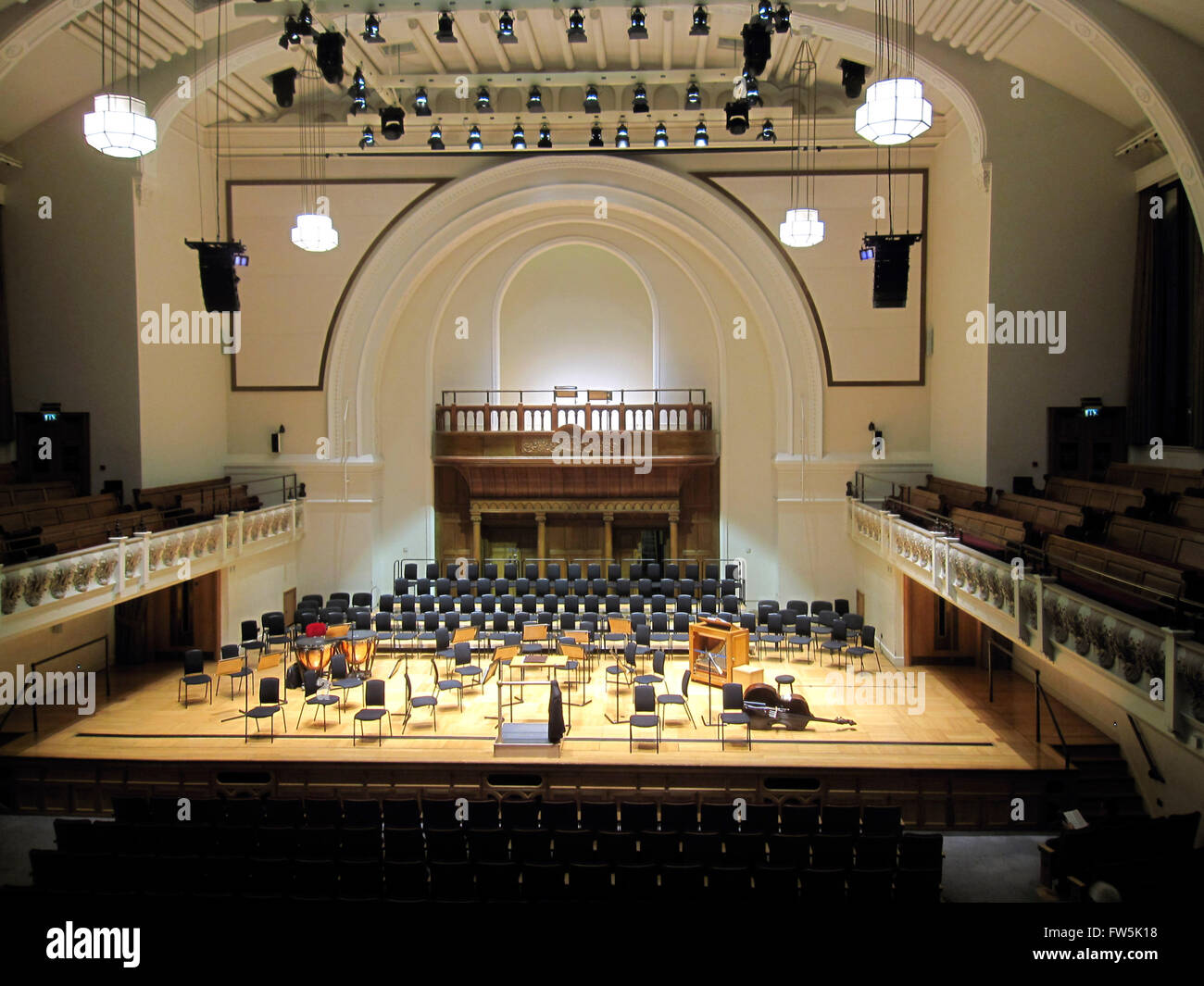 stage and auditorium of the concert platform of the Cadogan Hall, a new concert hall near Sloane Square, London, home of the Royal Philharmonic Orchestra, RPO. With dormant double bass. Stock Photo