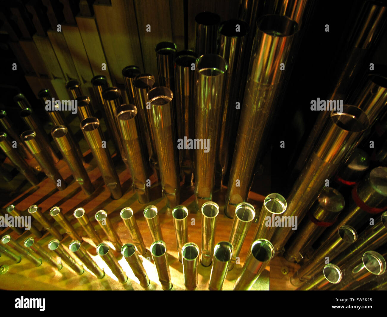 close-up from above of small metal organ pipes, from inside a chamber organ by Peter Collins Ltd.; this type of concert platform organ is used especially for continuo playing in Baroque orchestras. Stock Photo