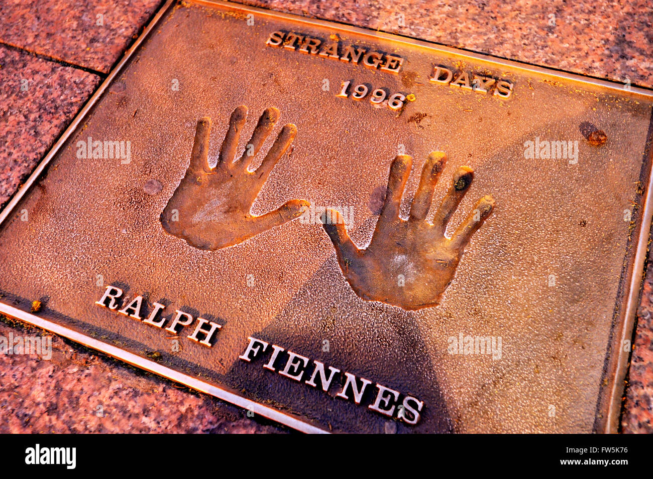 Ralph Fiennes bronze plaque of handprint set into the pavement of Leicester Square: of Ralph Fiennes, 'Strange Days', 1996. Stock Photo