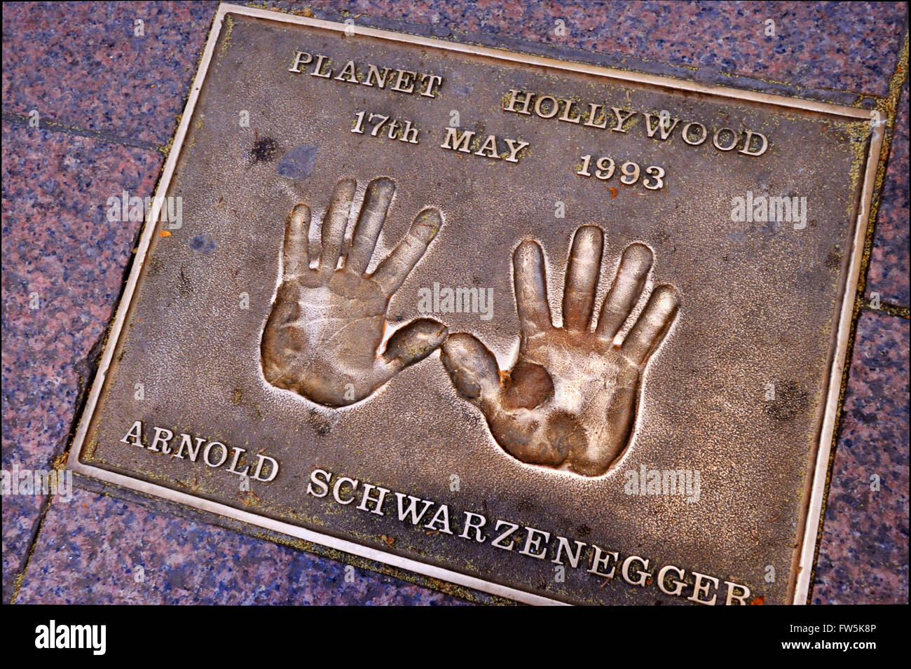Arnold Schwarzenegger bronze plaque of handprint set into the pavement of Leicester Square: of Arnold Schwarzenegger, 1993 Stock Photo