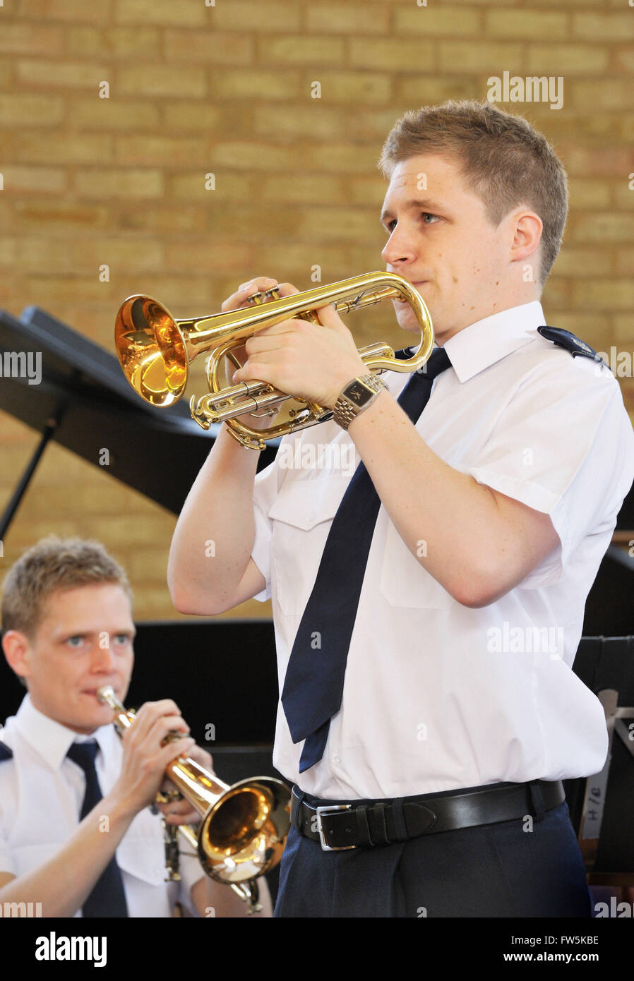Cornet soloist with Salvation Army Band playing before a service. Hendon, London NW4. In summer shirt-sleeves uniform. Continuing the high standards of British brass band playing. Stock Photo