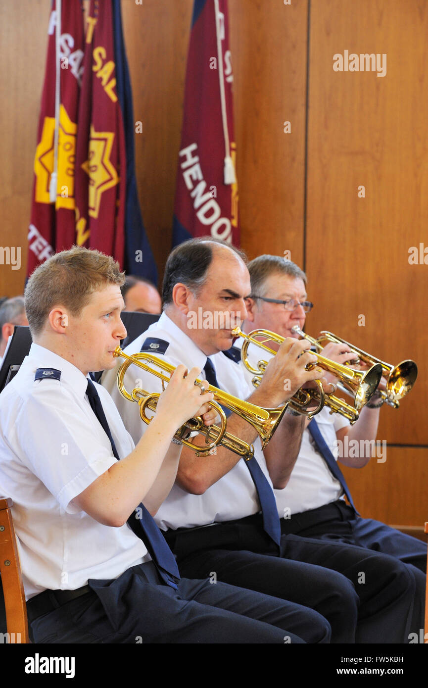 Cornet players with Salvation Army Band, playing before a service. Hendon, London NW4. In summer shirt-sleeves uniform. Continuing the high standards of British brass band playing. Stock Photo