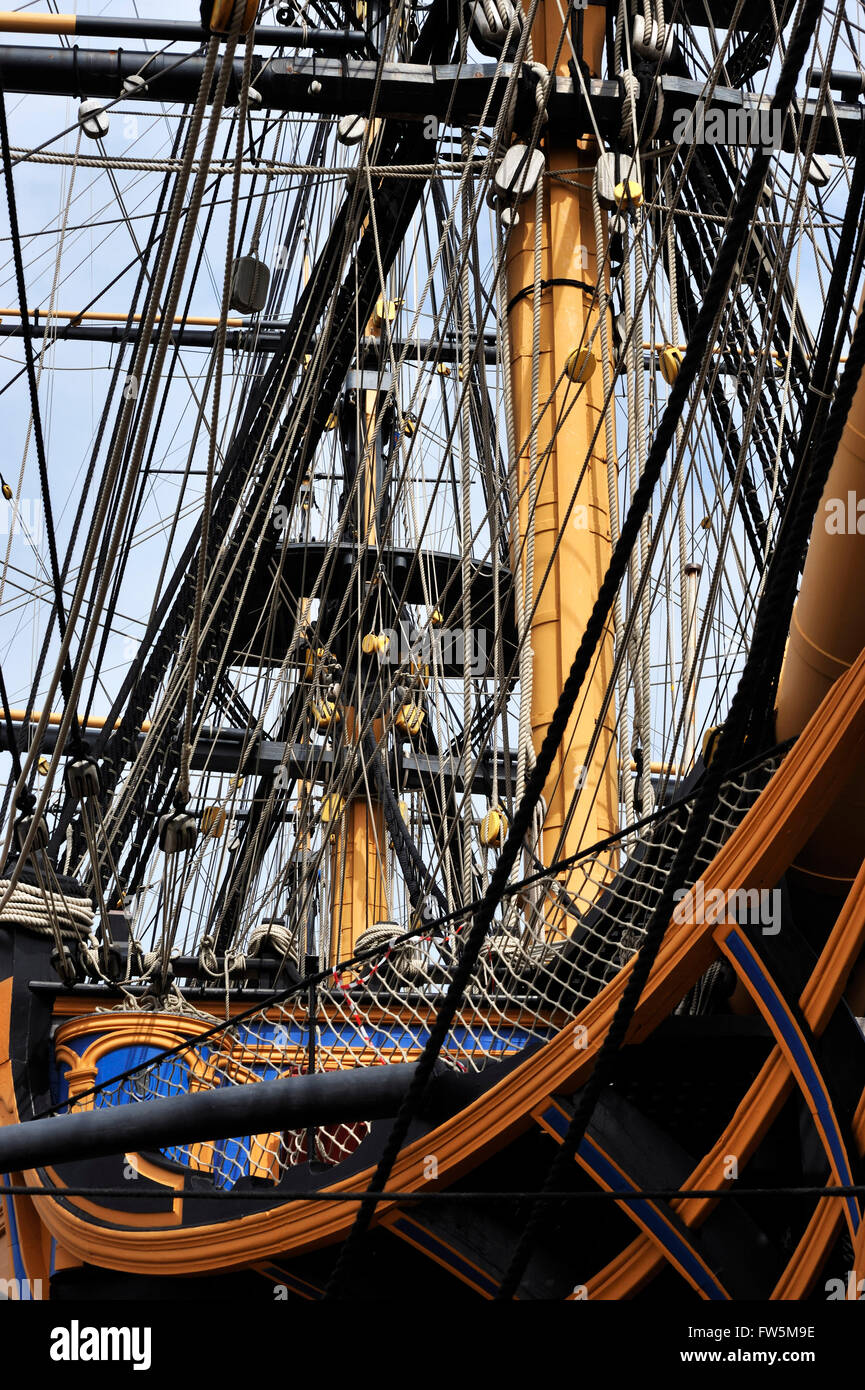 bows and rigging of HMS Victory, in Portsmouth Historic Dockyard. The only surviving naval warship that represents the skill of naval dockyard shipwrights, ship designers and the industrial ability of Britain during the mid 18th century. She was Admiral Lord Nelson's flagship at the battle of Trafalgar, 21 October 1805, the most decisive British naval victory of the Napoleonic Wars (1803-1815). Twenty-seven British ships defeated thirty-three French and Spanish ships under French Admiral Pierre Villeneuve. The British victory spectacularly confirmed the naval supremacy that Britain had establi Stock Photo