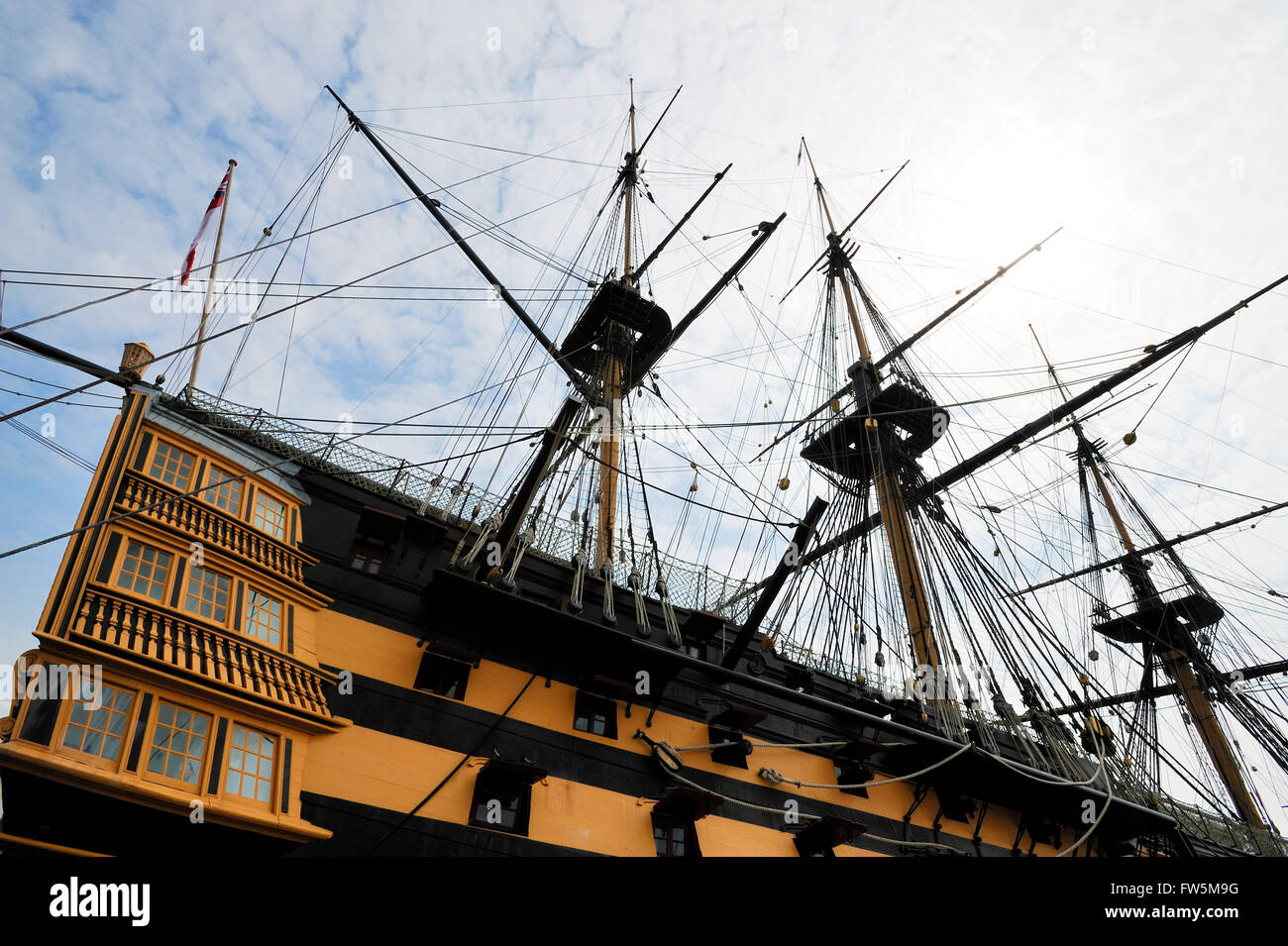 HMS Victory, in Portsmouth Historic Dockyard. The only surviving naval warship that represents the skill of naval dockyard shipwrights, ship designers and the industrial ability of Britain during the mid 18th century. She was Admiral Lord Nelson's flagship at the battle of Trafalgar, 21 October 1805, the most decisive British naval victory of the Napoleonic Wars (1803-1815). Twenty-seven British ships defeated thirty-three French and Spanish ships under French Admiral Pierre Villeneuve. The British victory spectacularly confirmed the naval supremacy that Britain had established during the past Stock Photo