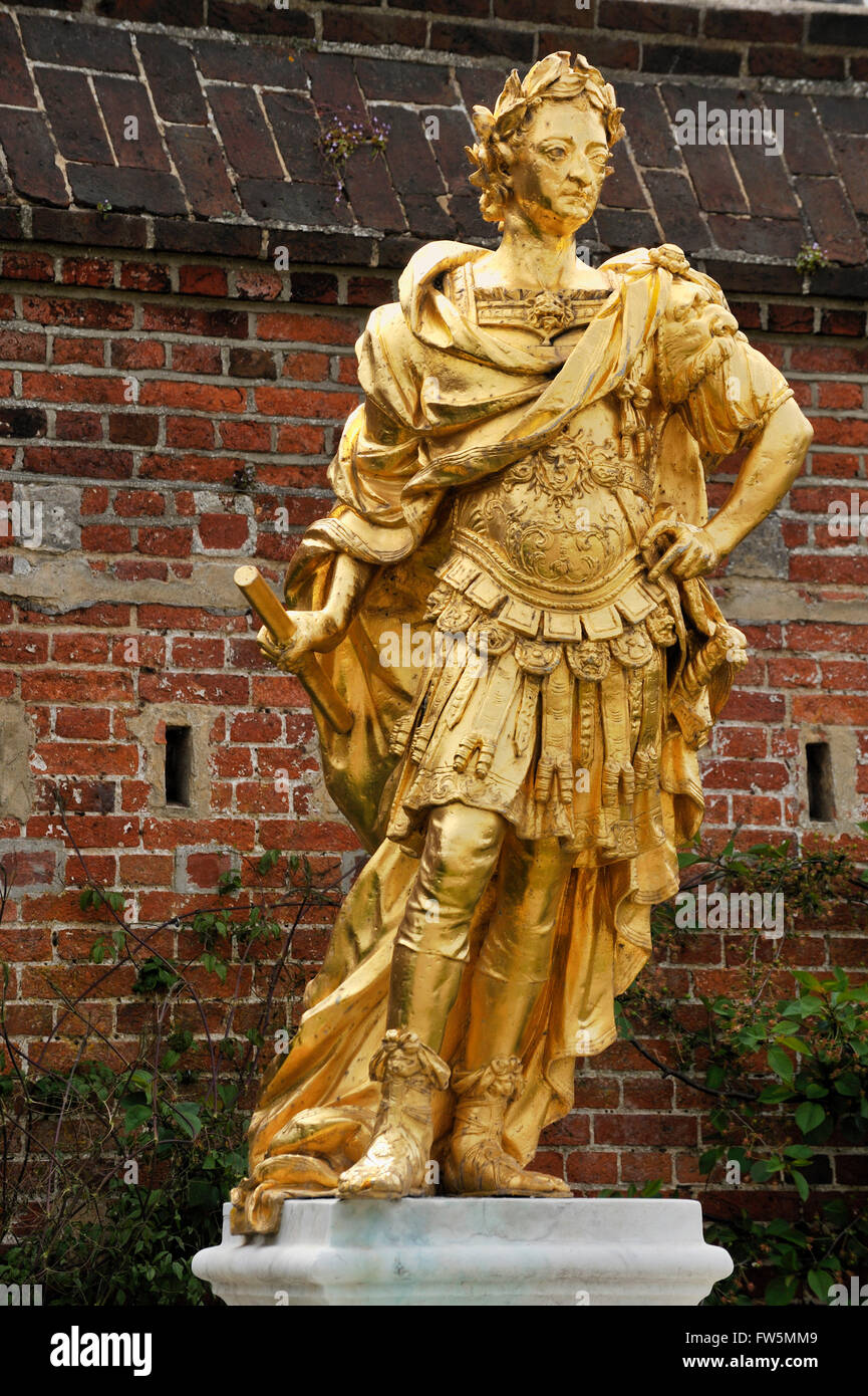 gold statue in Portsmouth Historic Dockyard of King William III. 1650 - 1702, a sovereign Prince of Orange by birth. From 1689 he reigned as William III over England and Ireland, and as William II over Scotland. He is informally known in Northern Ireland and Scotland as 'King Billy'.He ruled jointly with his wife, Mary II, until her death in 1694: the joint reign of 'William and Mary'.A Protestant, William participated in several wars against the powerful Catholic king of France, Louis XIV. William's victory over James II at the Battle of the Boyne in 1690 is commemorated by the Orange Institu Stock Photo