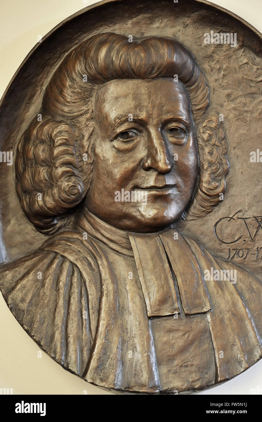bronze relief by Nicholas Dimbleby, 2007, to mark the tercentenary of the birth of the Revd Charles Wesley, co-founder of Methodism and composer of hymns. He lies buried here in the churchyard of Marylebone Parish Church, Marylebone Rd., London NW1. Stock Photo