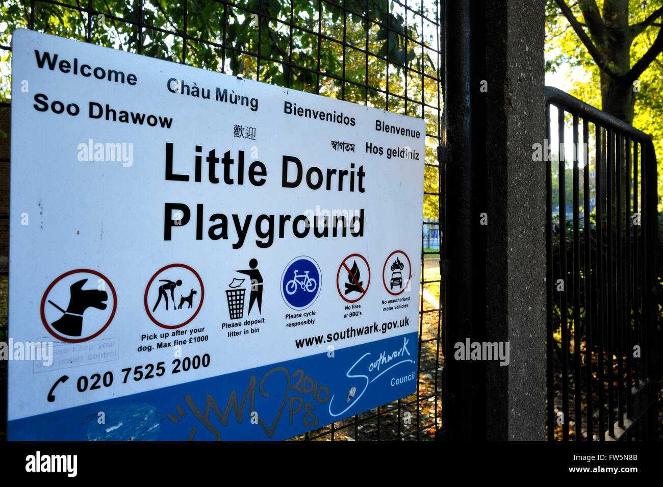playground sign, Little Dorrit Playground, Little Dorrit Court, by Borough High St., Southwark, London. Named after the book by English novelist Charles Dickens, who set scenes of his novel Little Dorrit in this area. Amy Dorrit's father, William, was imprisoned nearby at the Marshalsea prison, and St. George's church where Amy Dorrit was christened and married is adjacent to the Marshalsea. Stock Photo