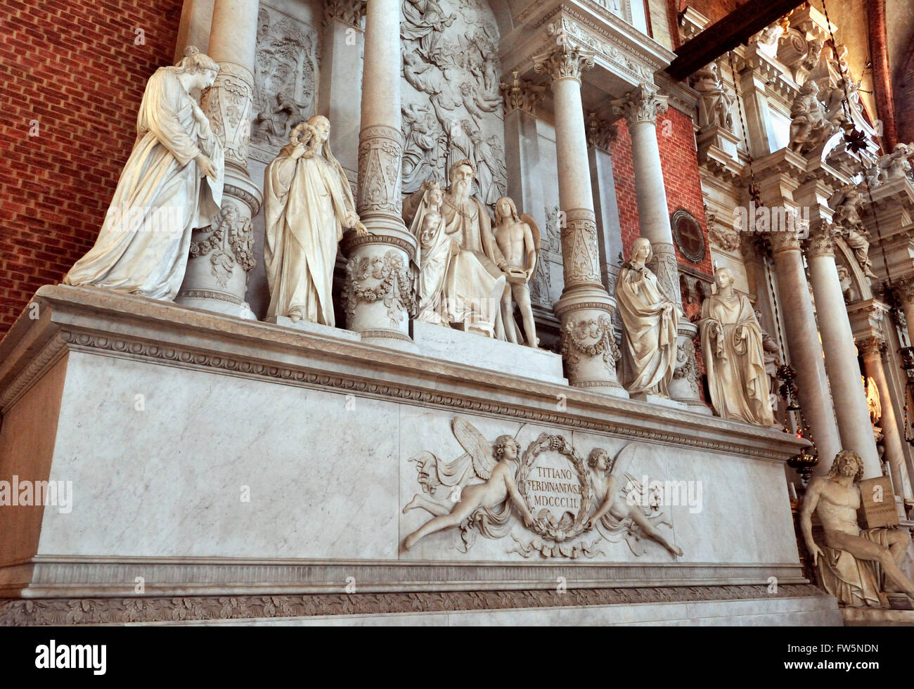 Titian monument, in the church of the Frari, the Basilica di Santa Maria Gloriosa dei Frari, Venice, church built 1338. Tiziano Vecelli or Tiziano Vecellio (c. 1488/1490 - 27 August 1576) better known as Titian, Italian painter, the most important member of the 16th-century Venetian school. Erected in 1852 by Ferdinand L, (1838-52, ) with muses: Sculpture, Architecture, Painting, Wood-carving. Titian himself is seated in the centre ; behind him is a relief representing his famous picture of the Assumption (the High Altar-piece of this Franciscan church) and altar. A winged Venetian lion is on Stock Photo